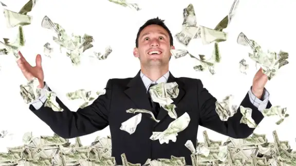 business millionaire over white - dollars coming down.jpeg