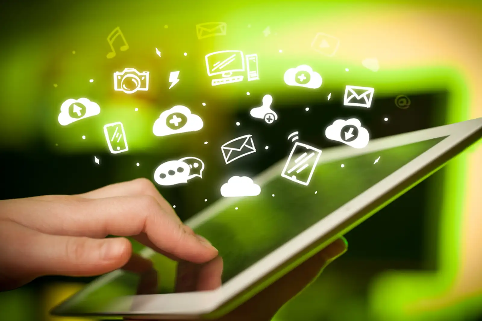 Hand holding tablet with social media concept.jpeg
