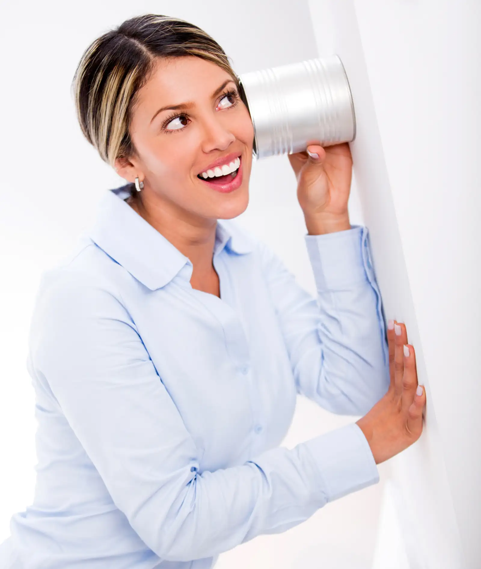 Businesswoman listening to secrets behind a wall.jpeg