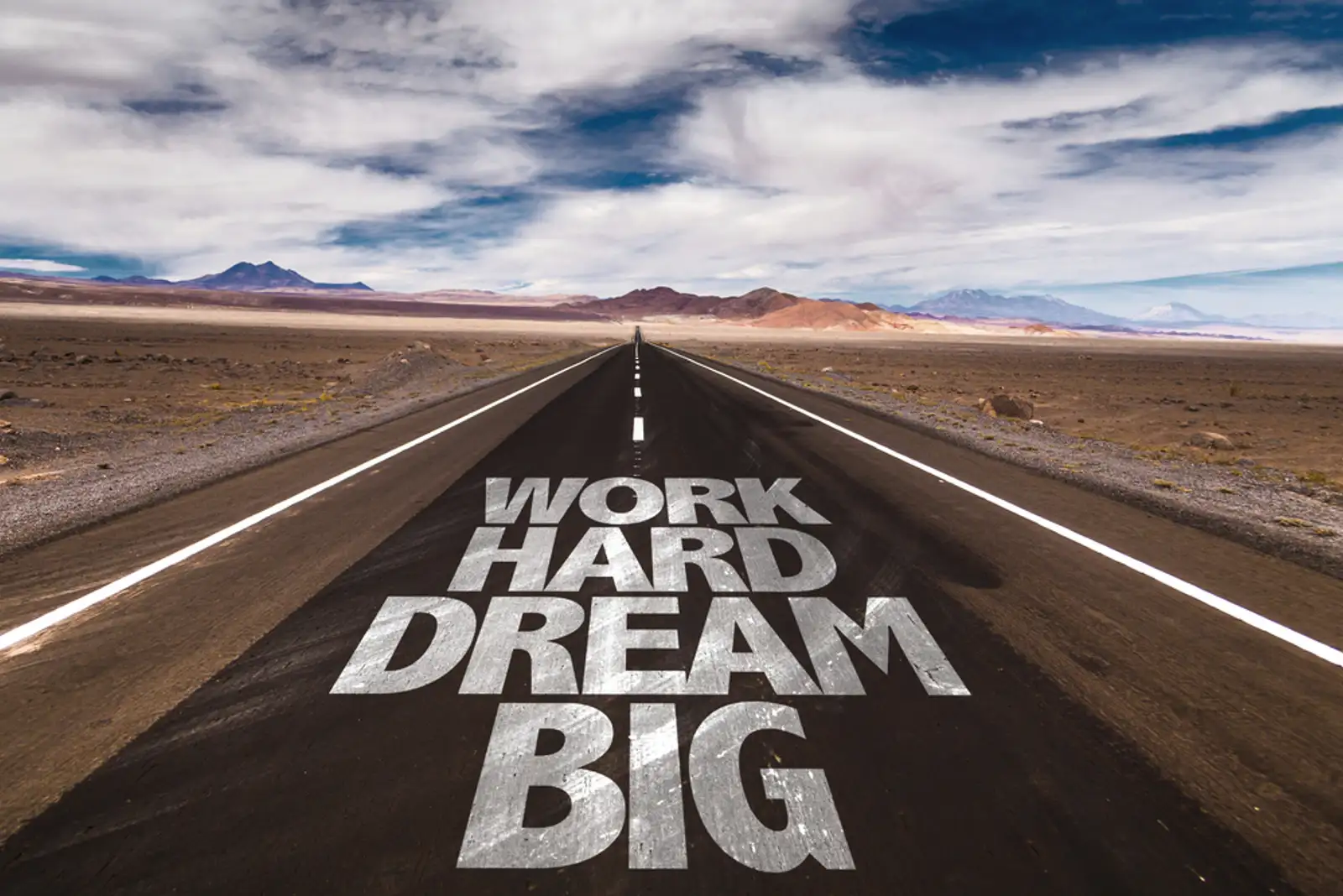 Work Hard Dream Big written on desert road.jpeg
