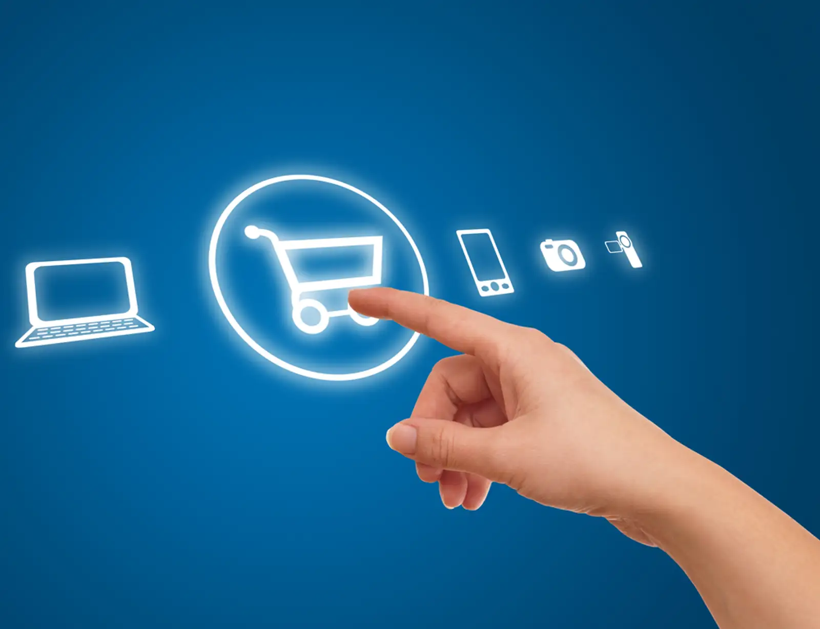 hand choosing shopping cart symbol from media icons on blue-1.jpeg