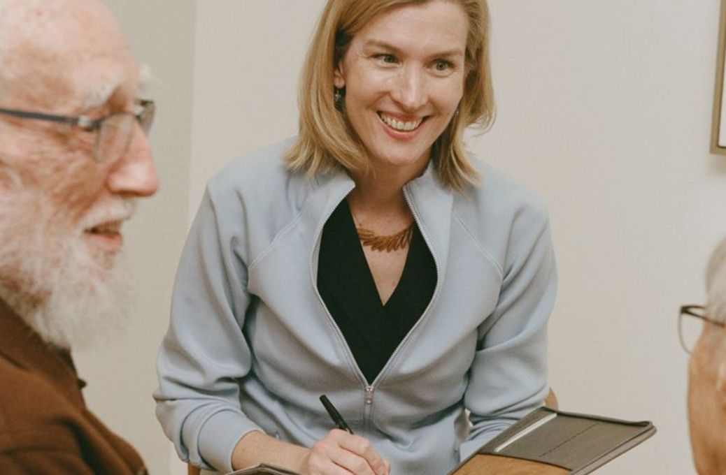Woman holding other woman's hand