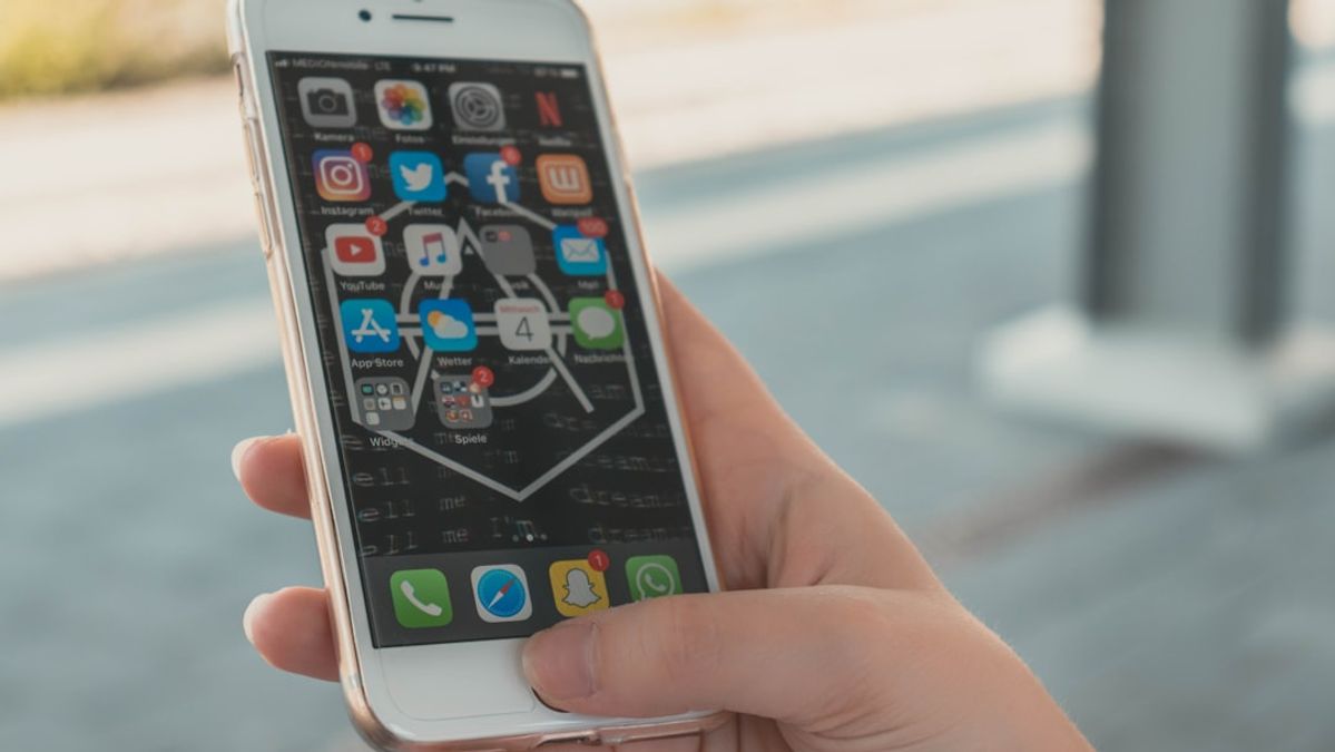 Person viewing an Instagram feed with social media ads on a smartphone