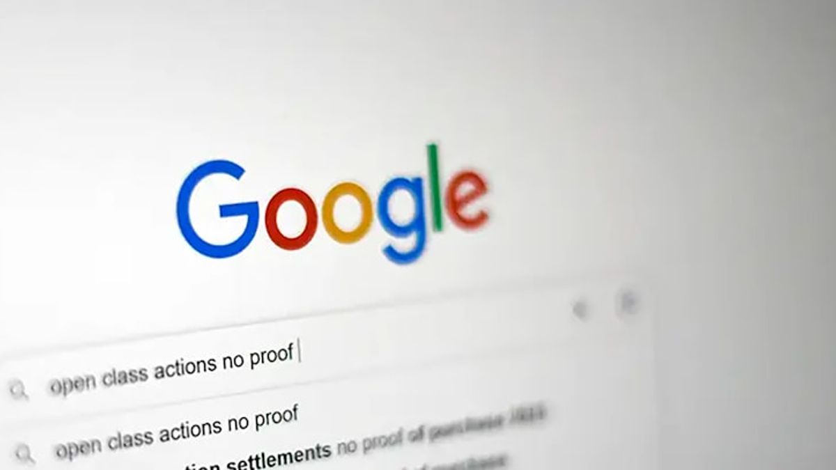 Marketer reviewing Google Ads search campaign performance on a laptop