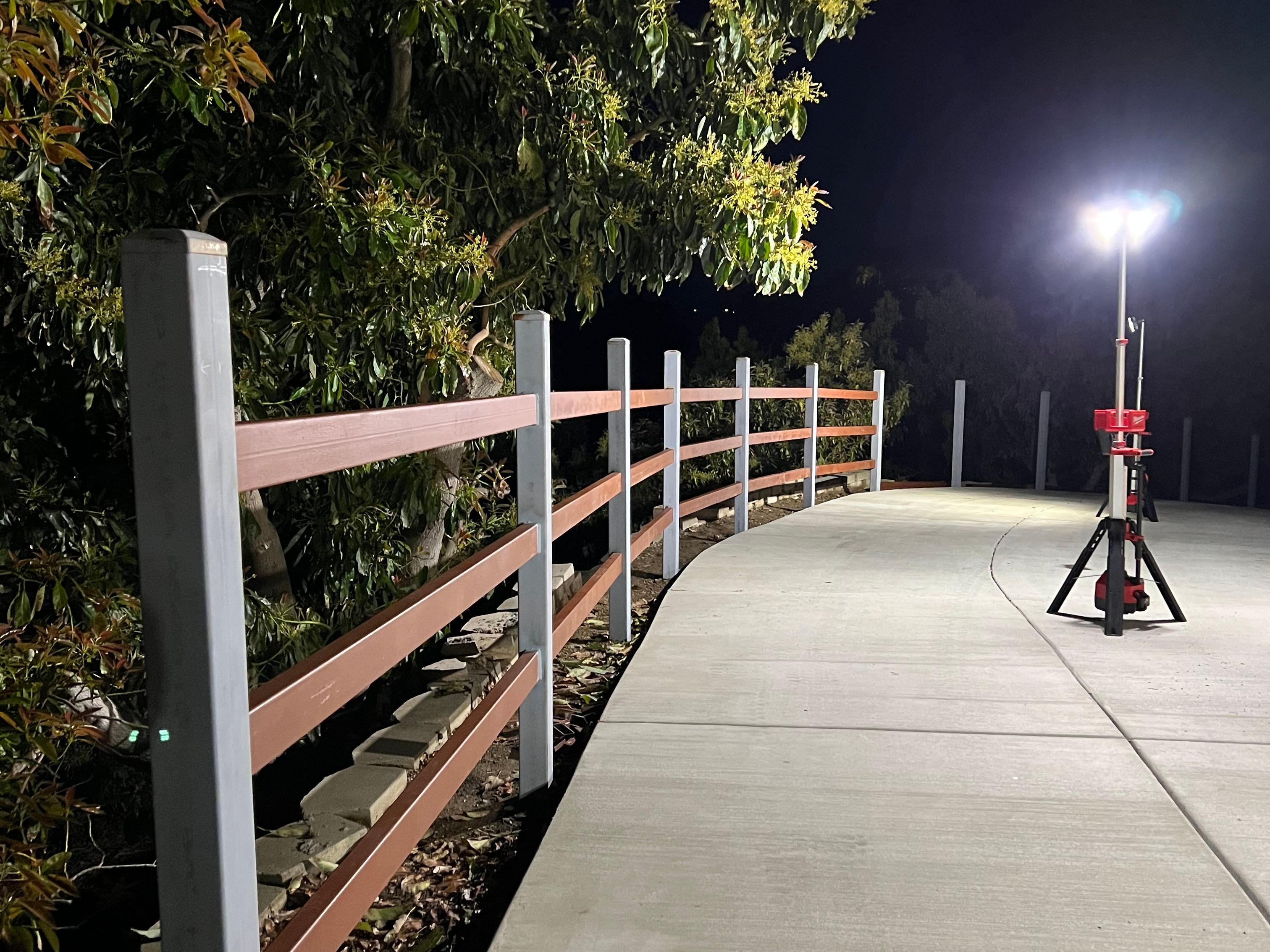 final touches on a metal fence 