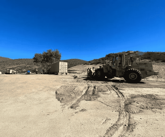 Heavy equipment vehicle brought into to move shipping containers 