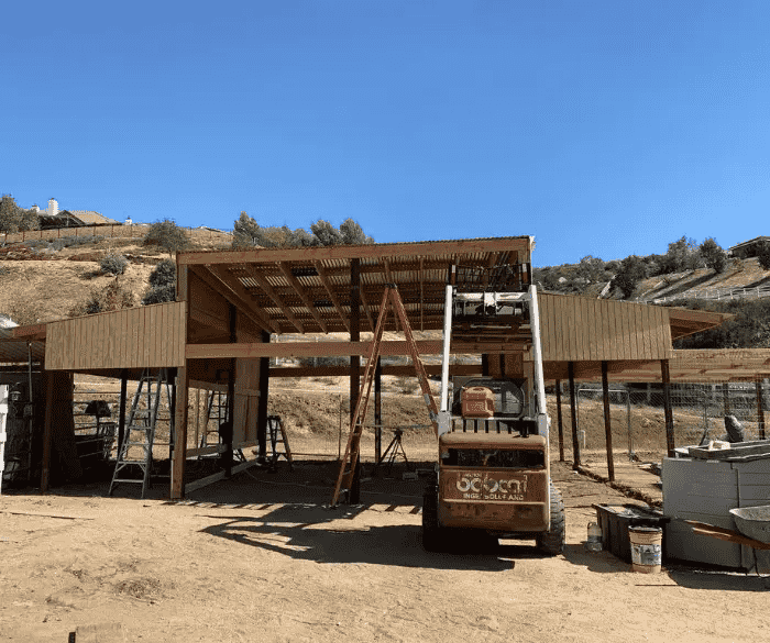 Photo of a barn being constructed 