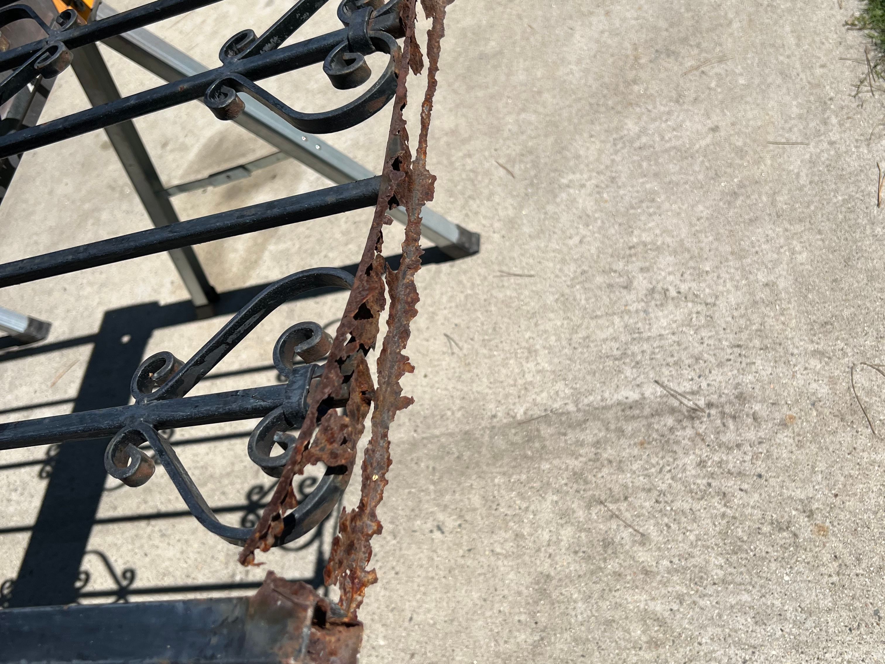 rusted bottom part of fence.