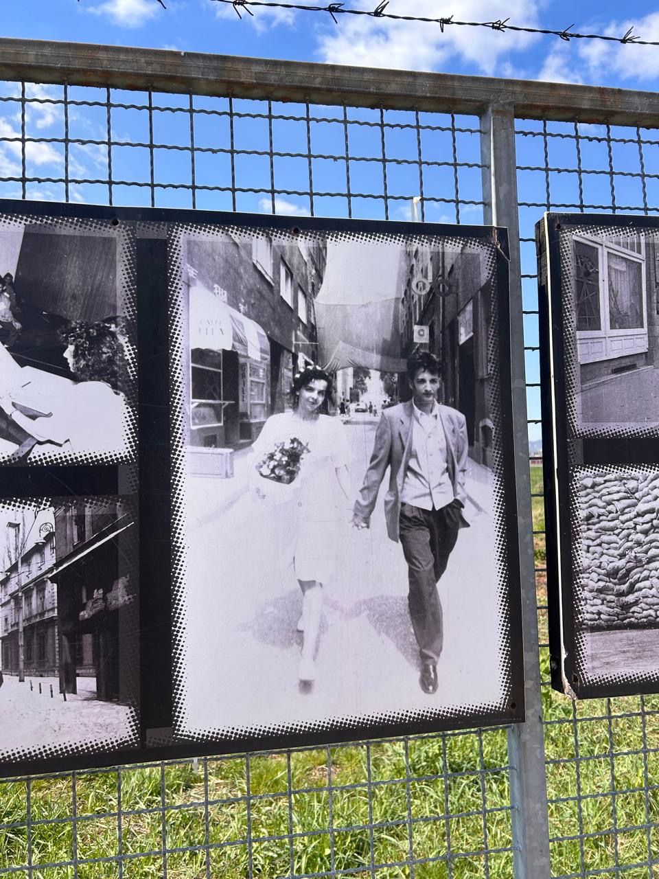 Historical photo displayed at the Sarajevo Tunnel Museum: a newly married couple walking during the siege