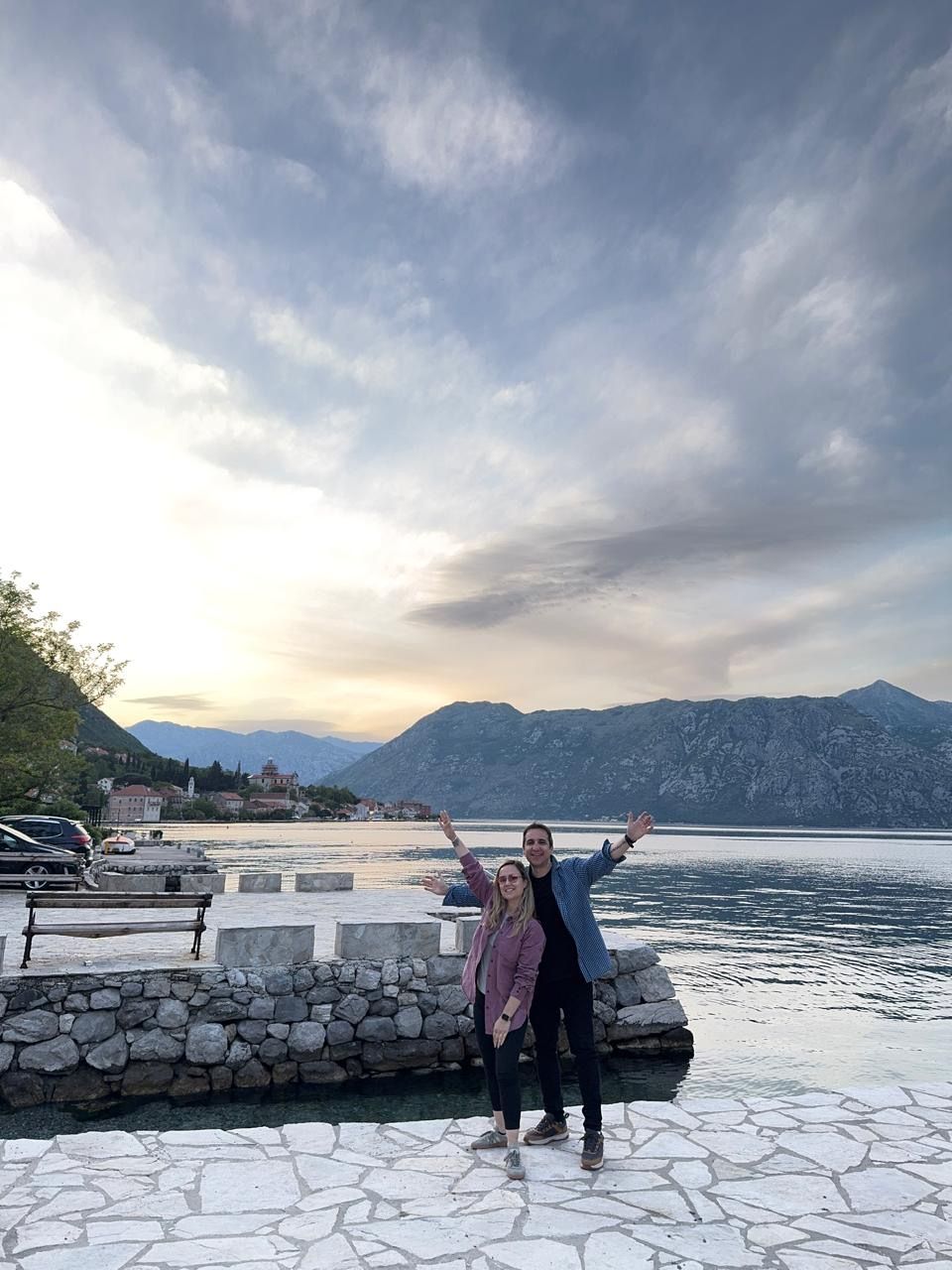 Couple at sunset by the water in Perast
