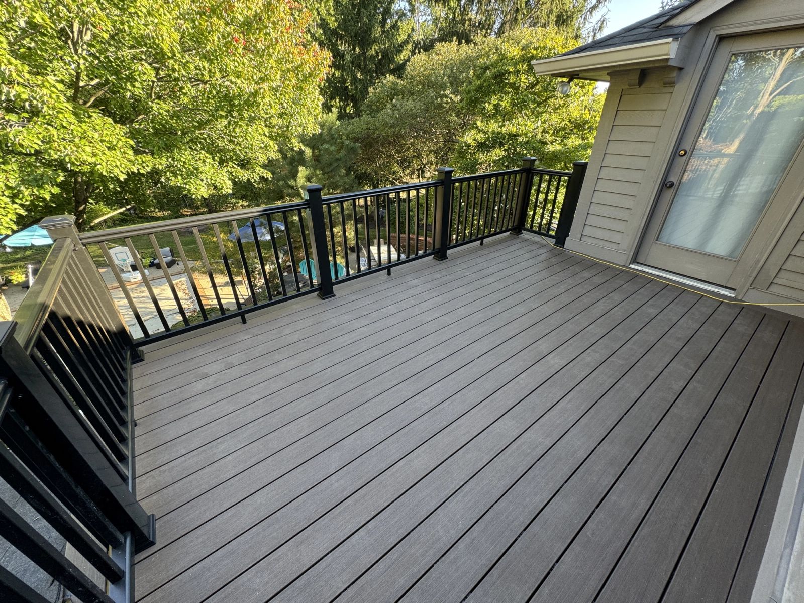 McCordsville home renovation rooftop deck showing waterproof surface and railing