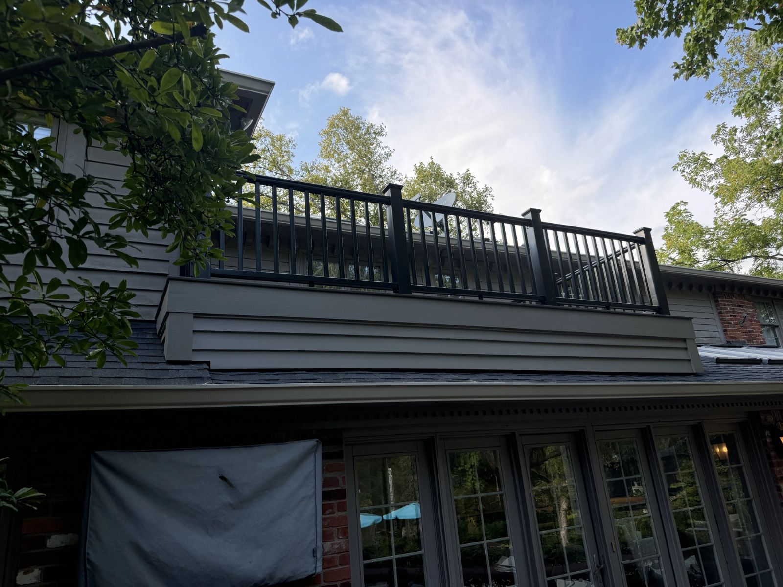 Completed rooftop deck with black aluminum railing in McCordsville Indiana