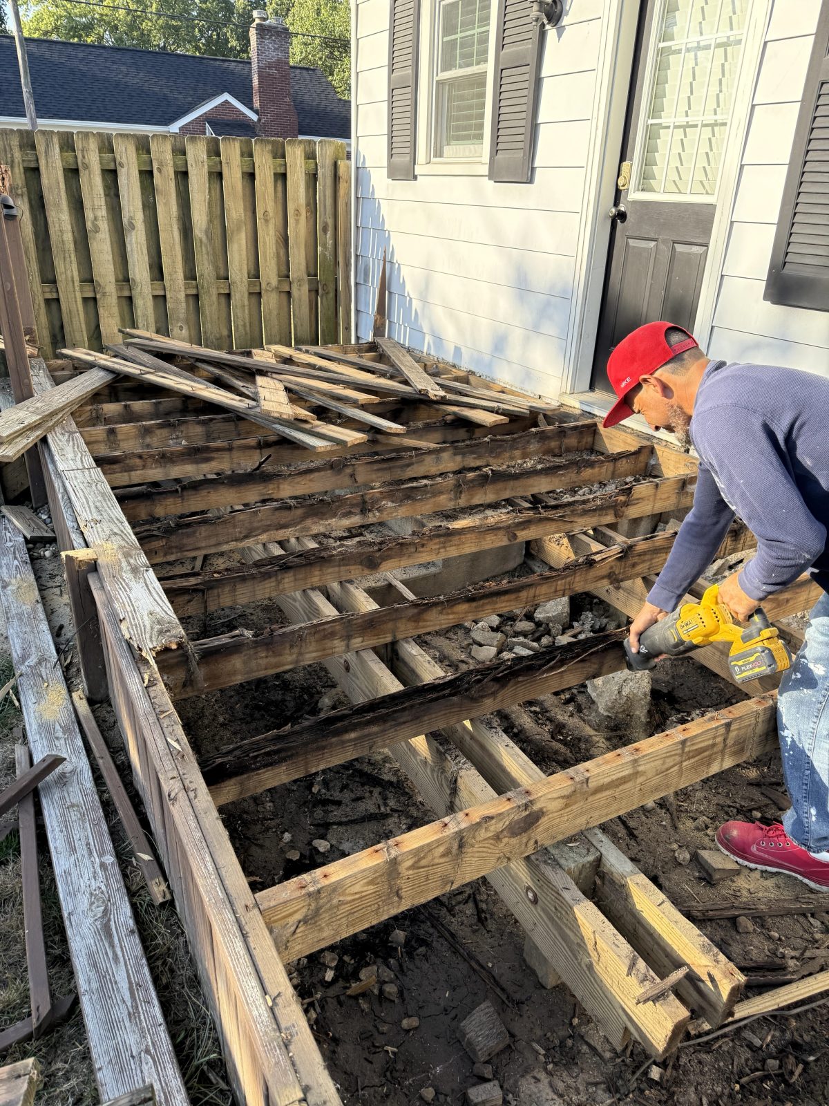 Before photo of Fountain Square backyard prior to deck and fence installation
