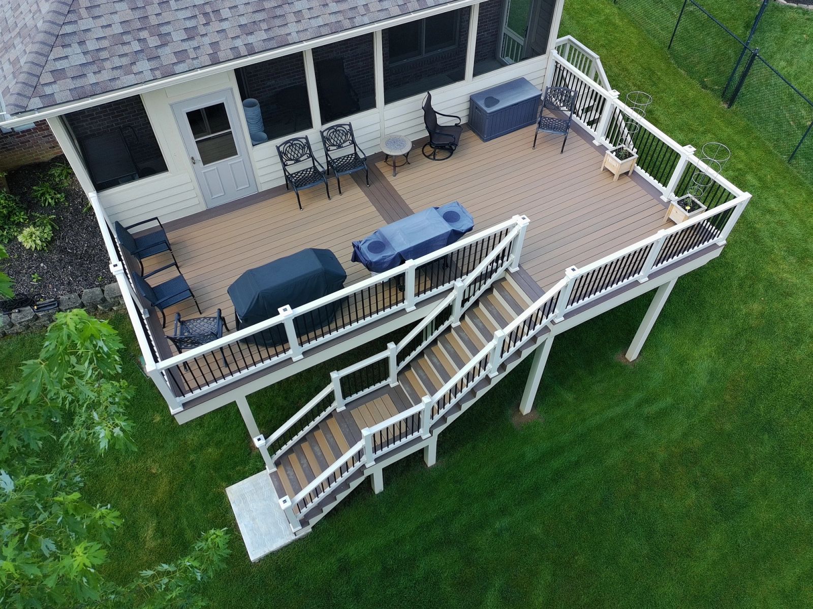 Aerial drone view of composite deck with stairs and vinyl railing in Gary