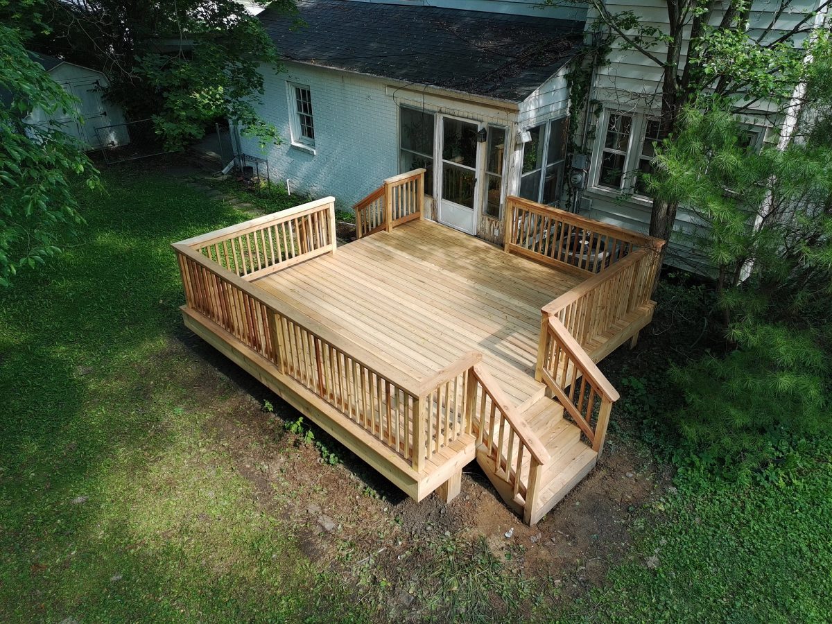Aerial view of custom elevated deck with cedar railing and integrated stairs in Greenwood Indiana
