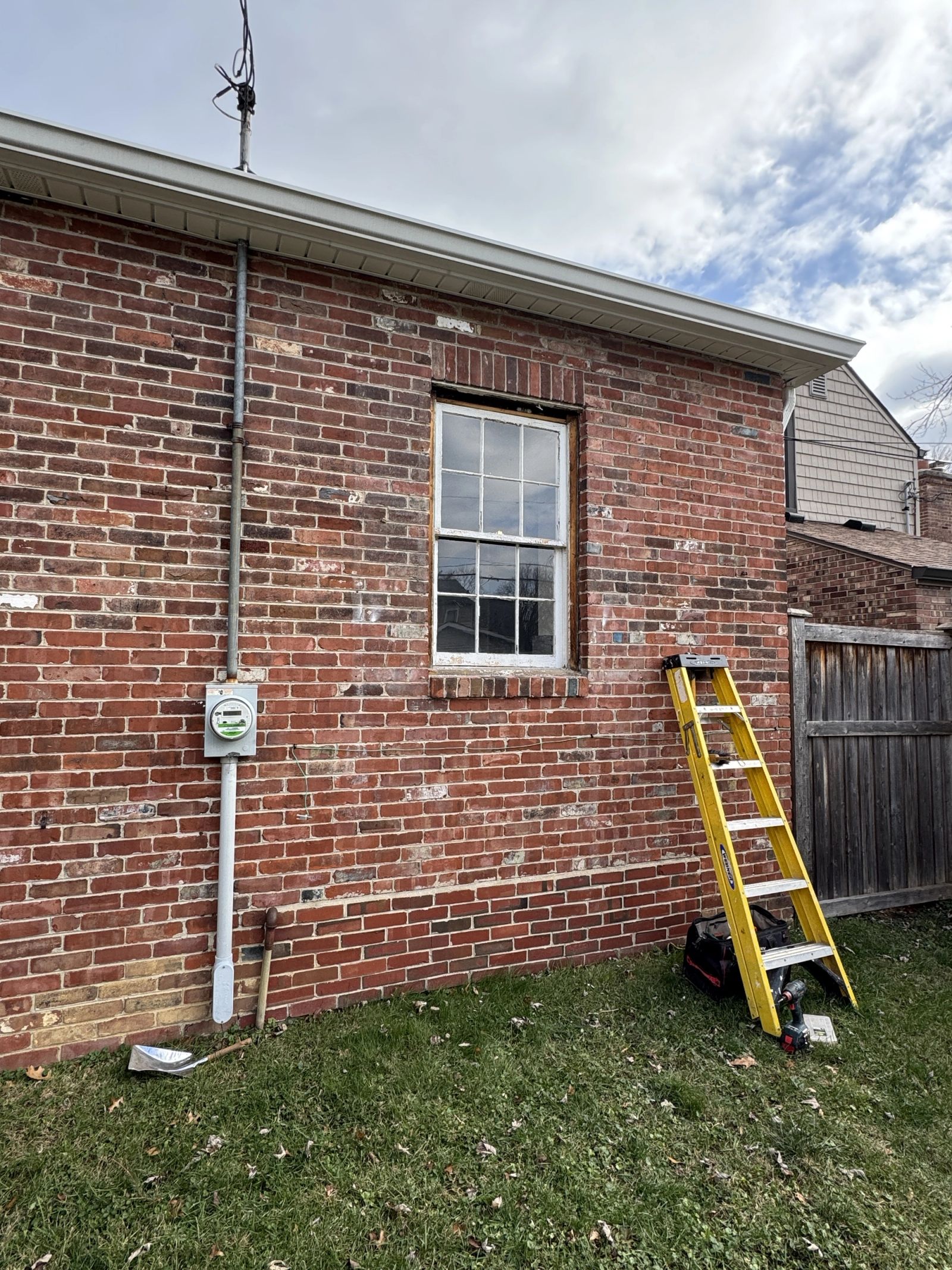 Before photo of window opening in Speedway Indiana prior to door installation