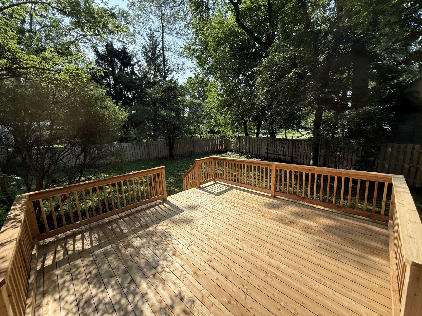 Custom residential deck in Greenwood showing quality carpentry and finishing work