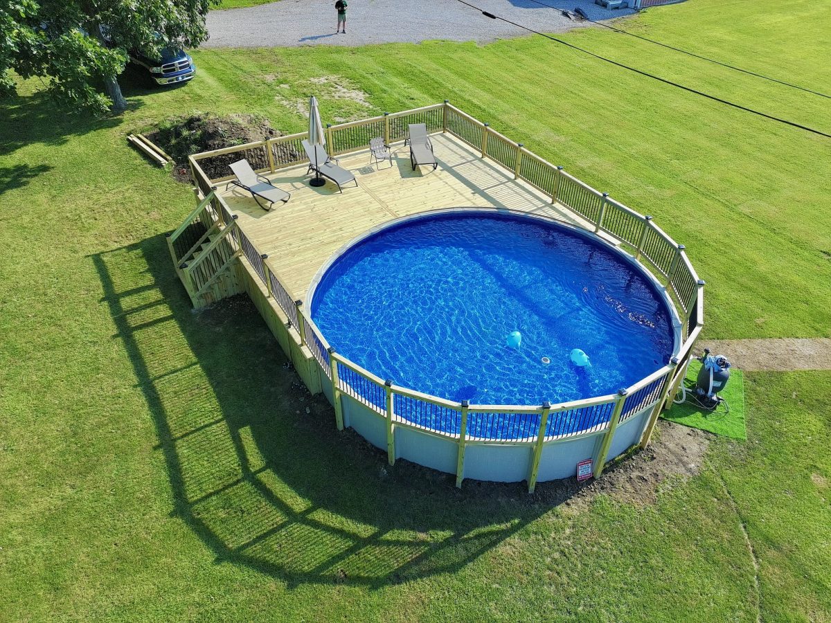 Aerial view of custom pool deck surrounding above-ground pool in Camby Indiana