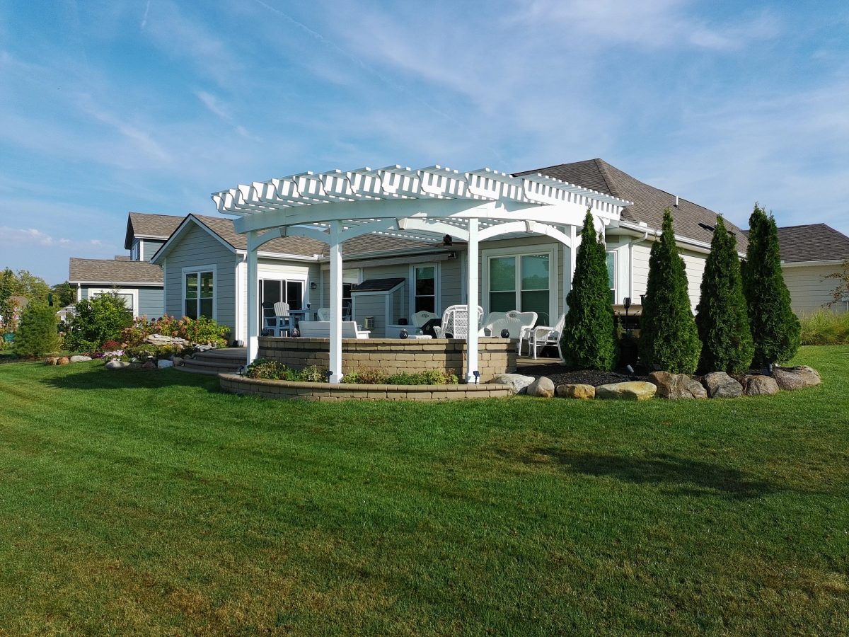 Custom white pergola with lattice detail and composite deck in Plainfield Indiana