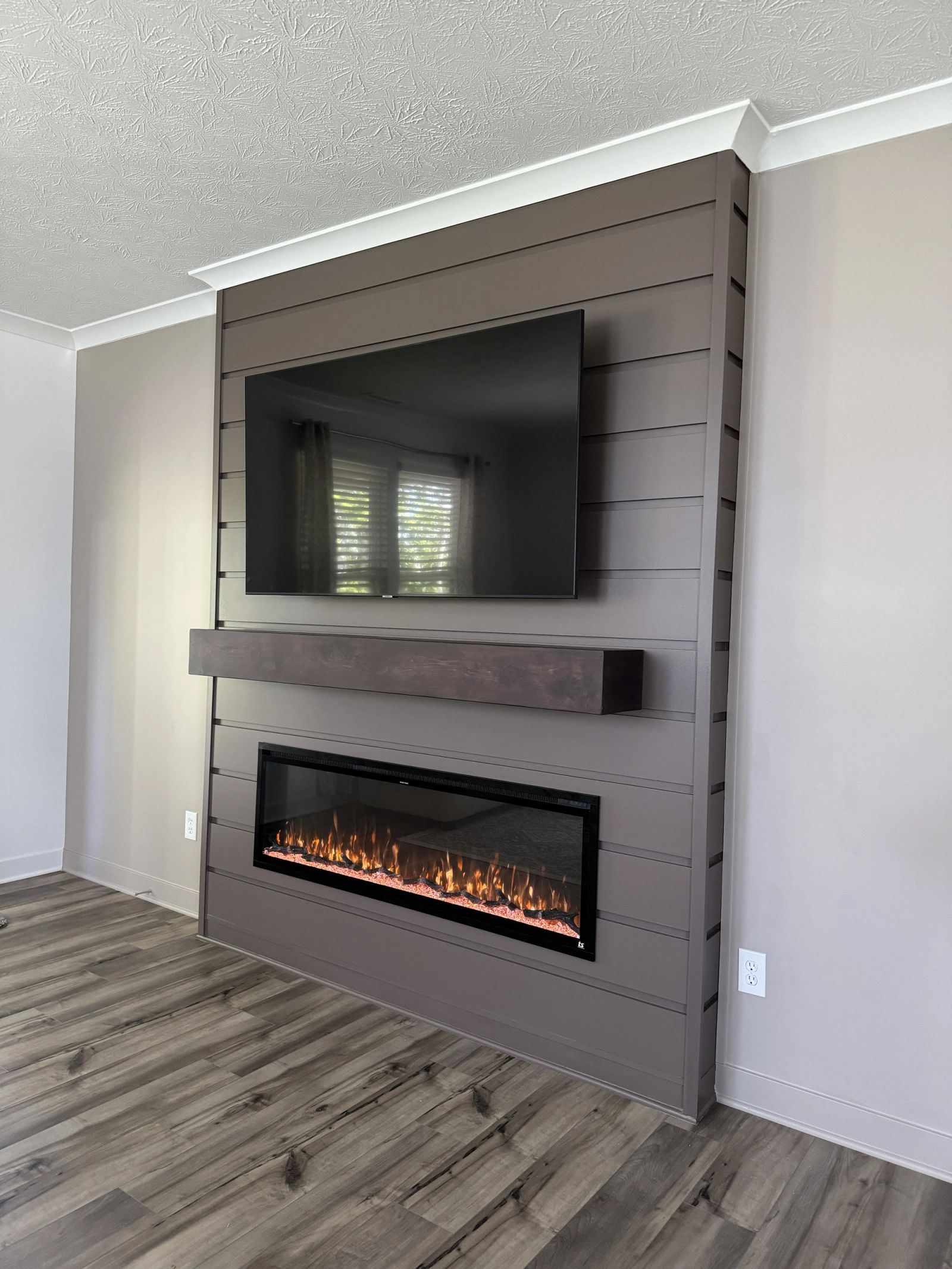 Custom fireplace feature wall with shiplap and floating mantle in Westfield Indiana