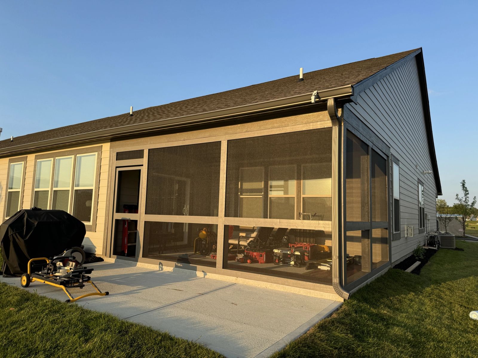 Westfield residential screened porch construction with floor-to-ceiling screens and concrete patio
