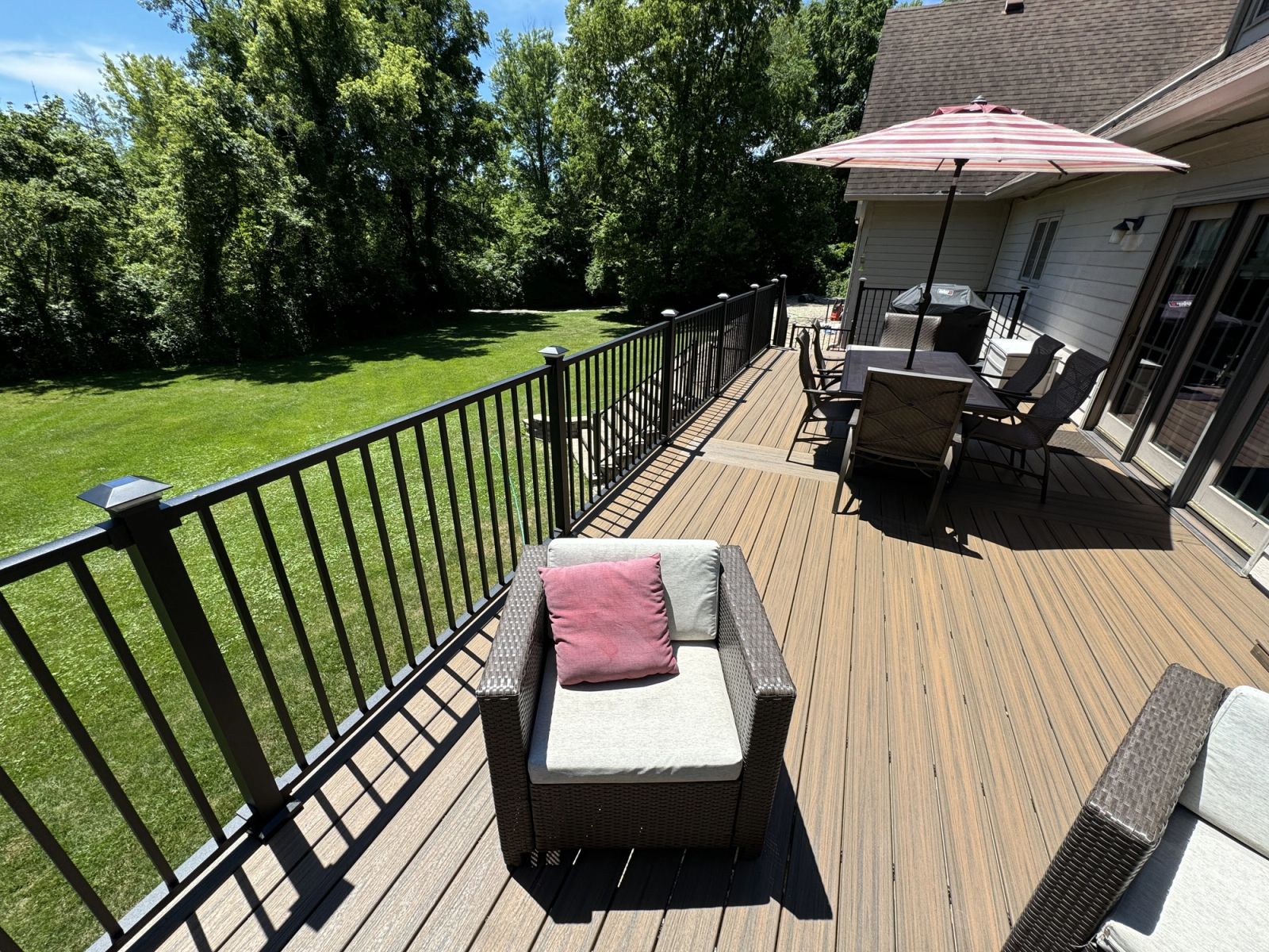 Geist area deck construction showing covered patio and walk-out basement access