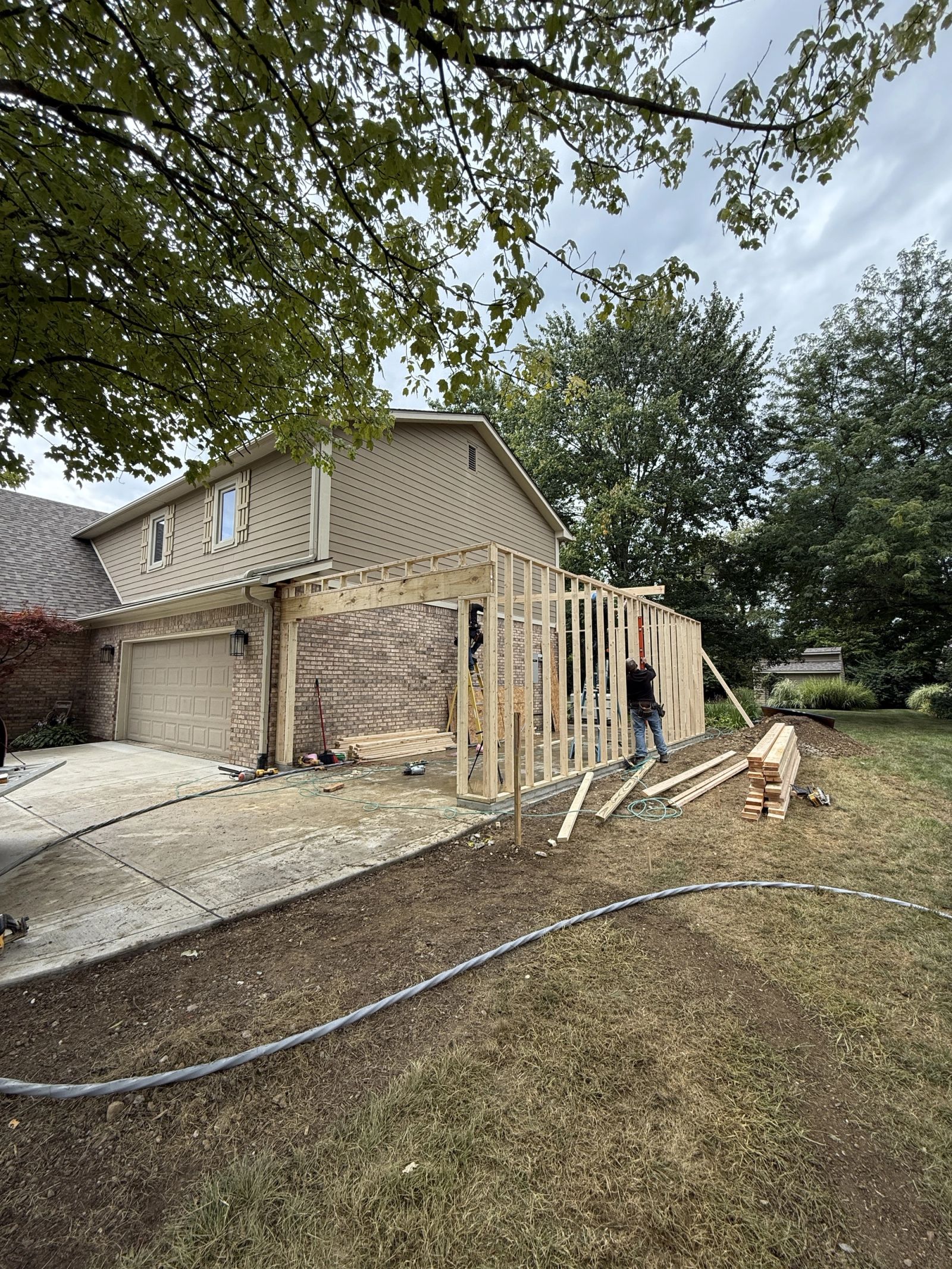 Garage addition framing in progress in Brownsburg Indiana showing professional construction