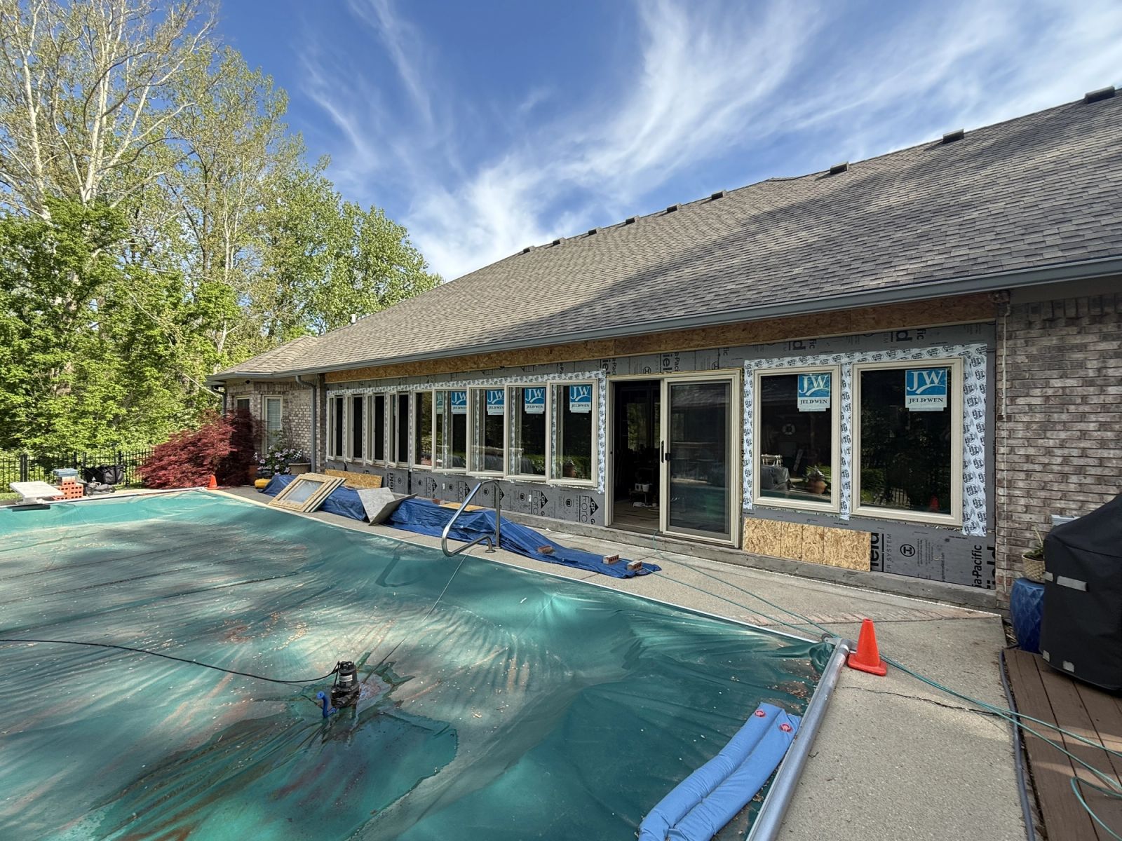 Lawrence screened porch renovation in progress showing window installation