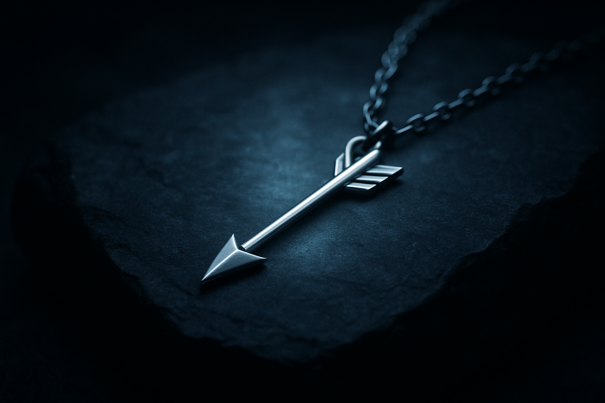 Minimalist silver arrow pendant symbolizing protection and direction
