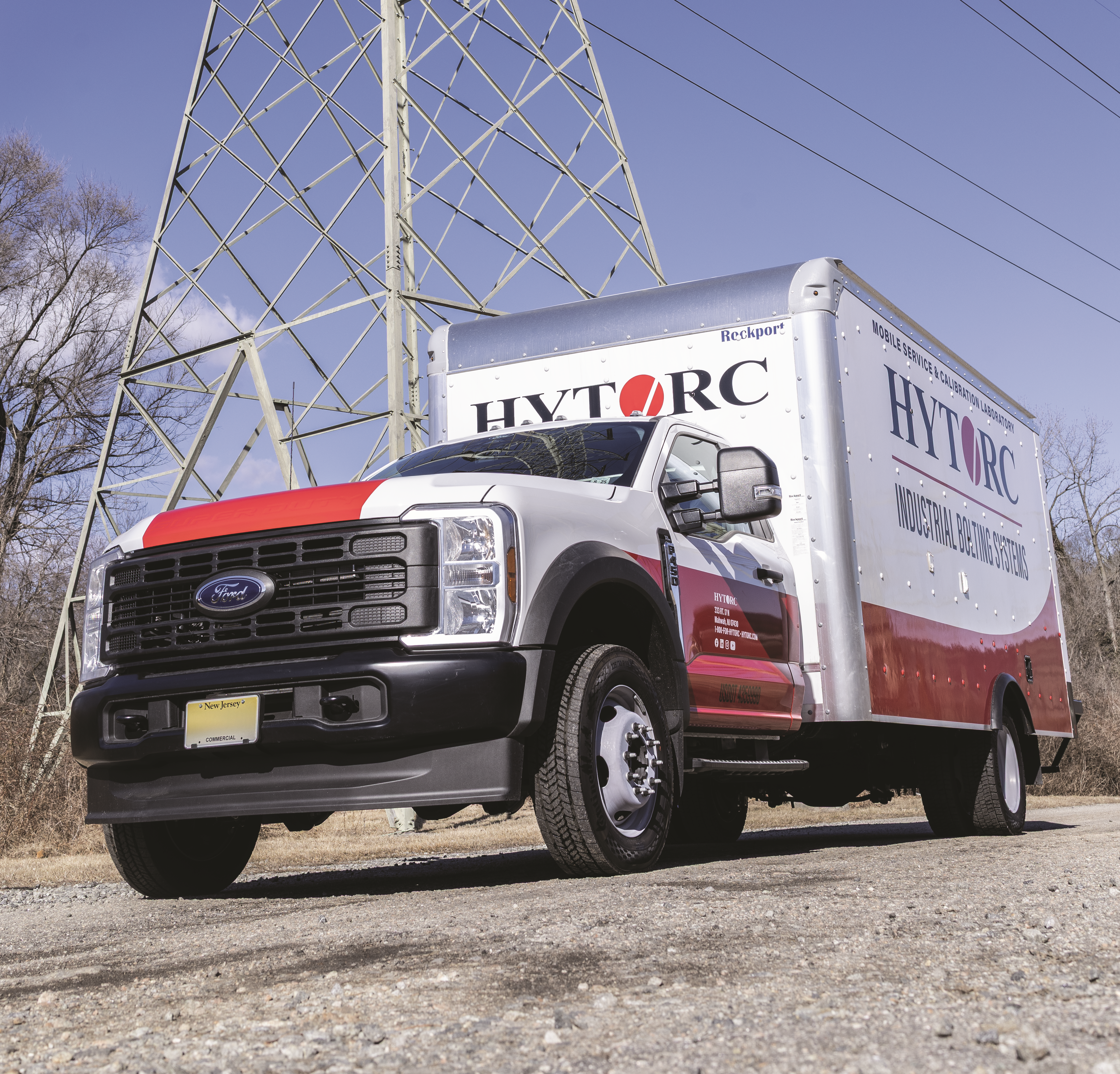 hytorc box service truck in front of power lines