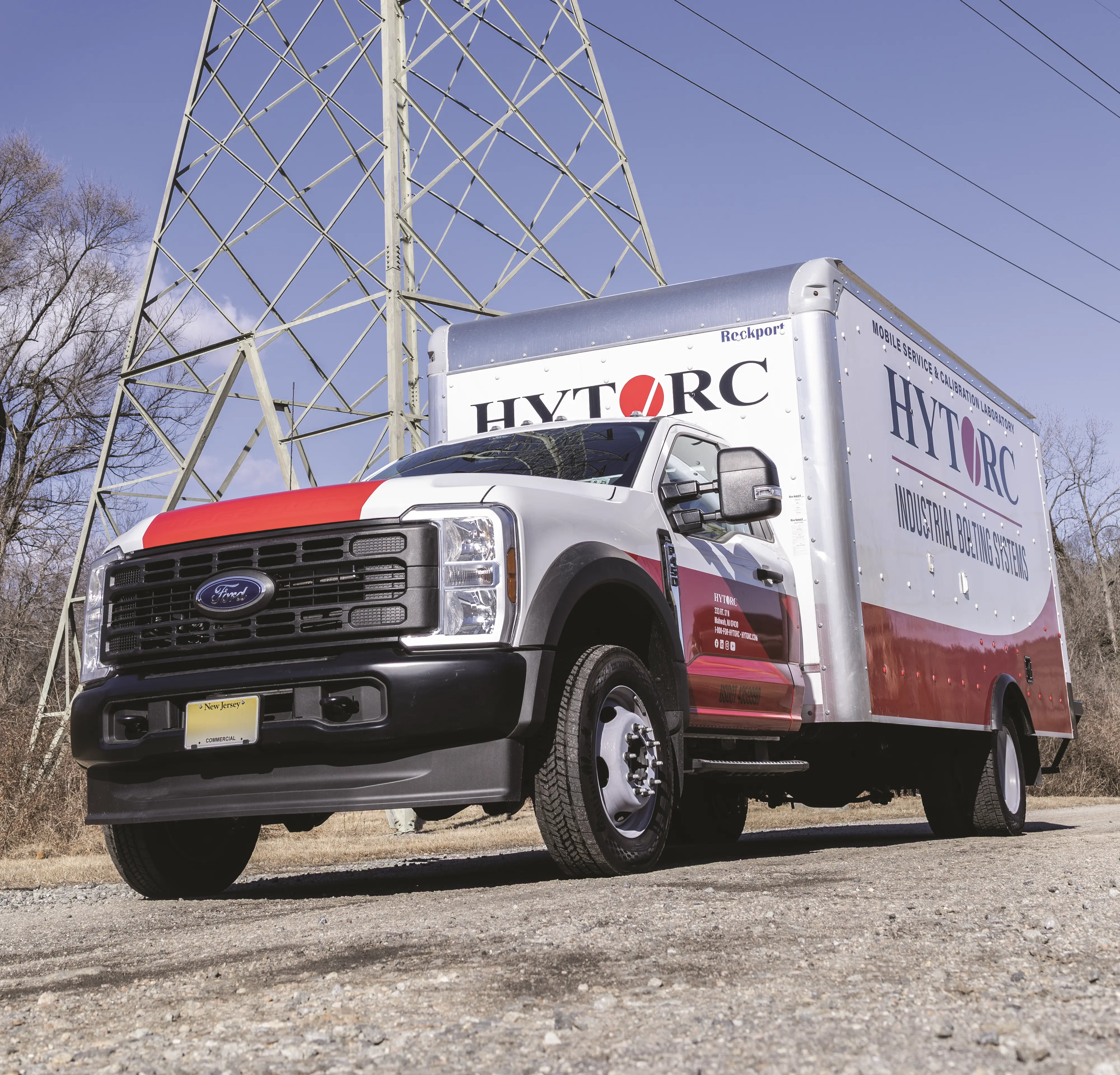 hytorc box service truck in front of power lines