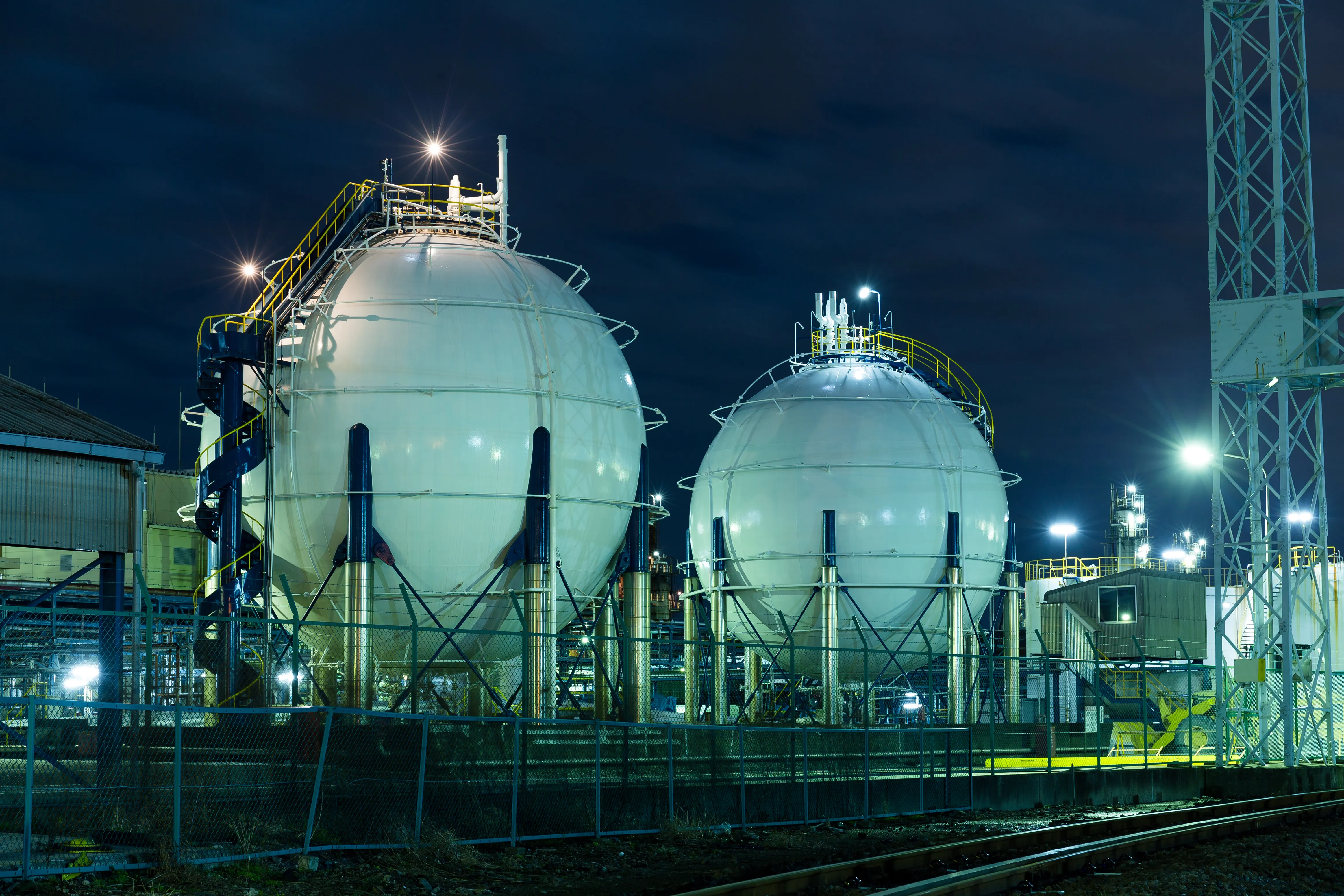 LNG gas storage tanks at night