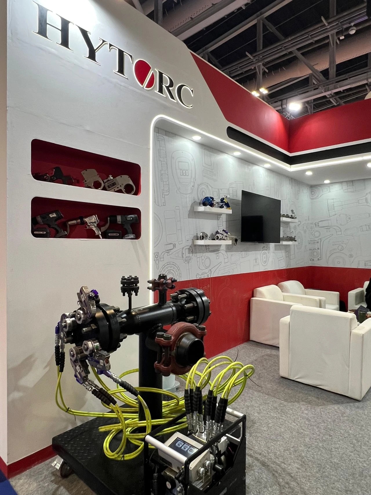 demo flange with bolts and hoses at hytorc booth at Oman Petroleum & Energy Show  opes in muscat oman