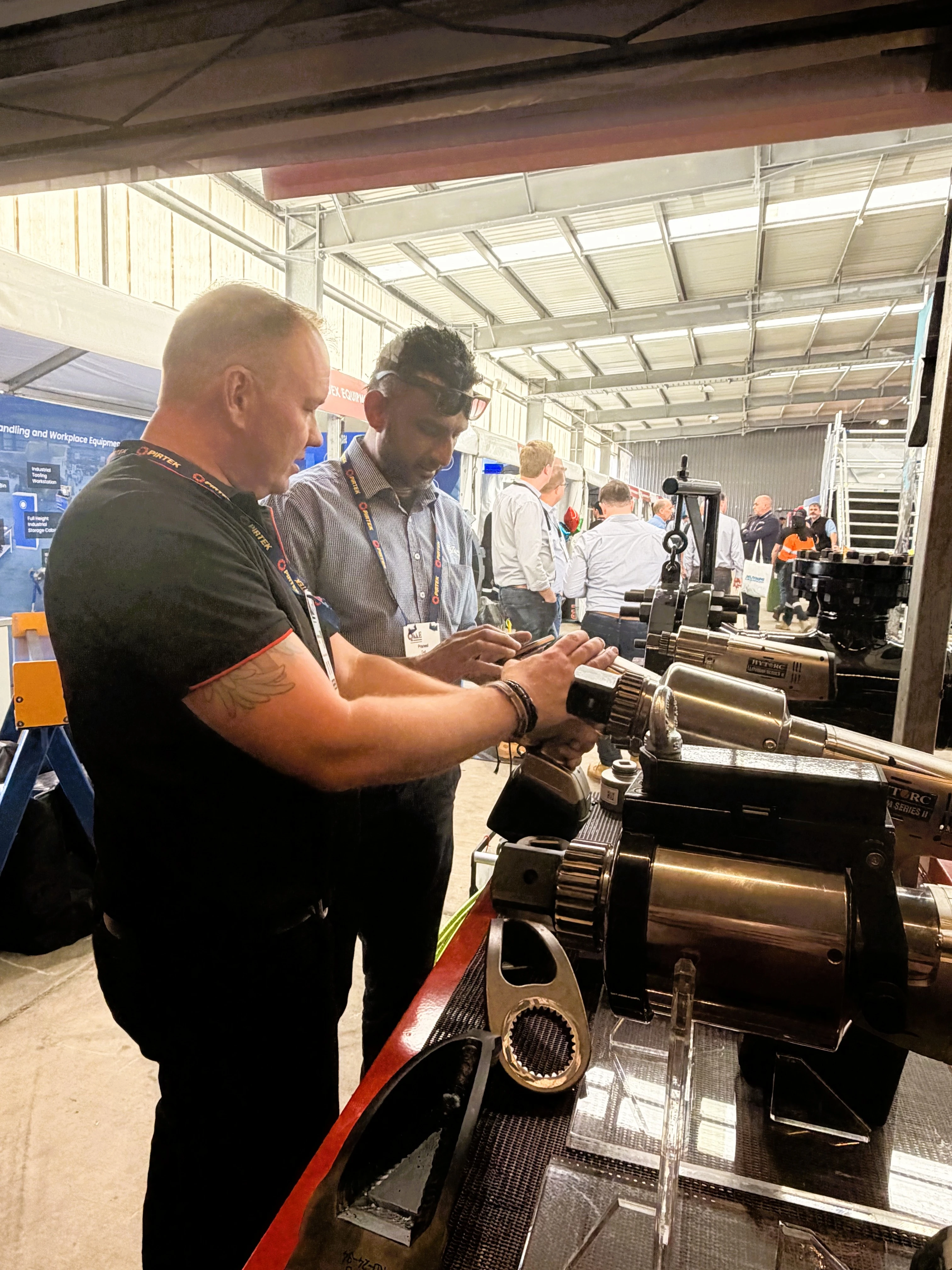 HYTORC Australia Queensland Mining & Engineering Exhibition people doing bolting torque tool demonstration