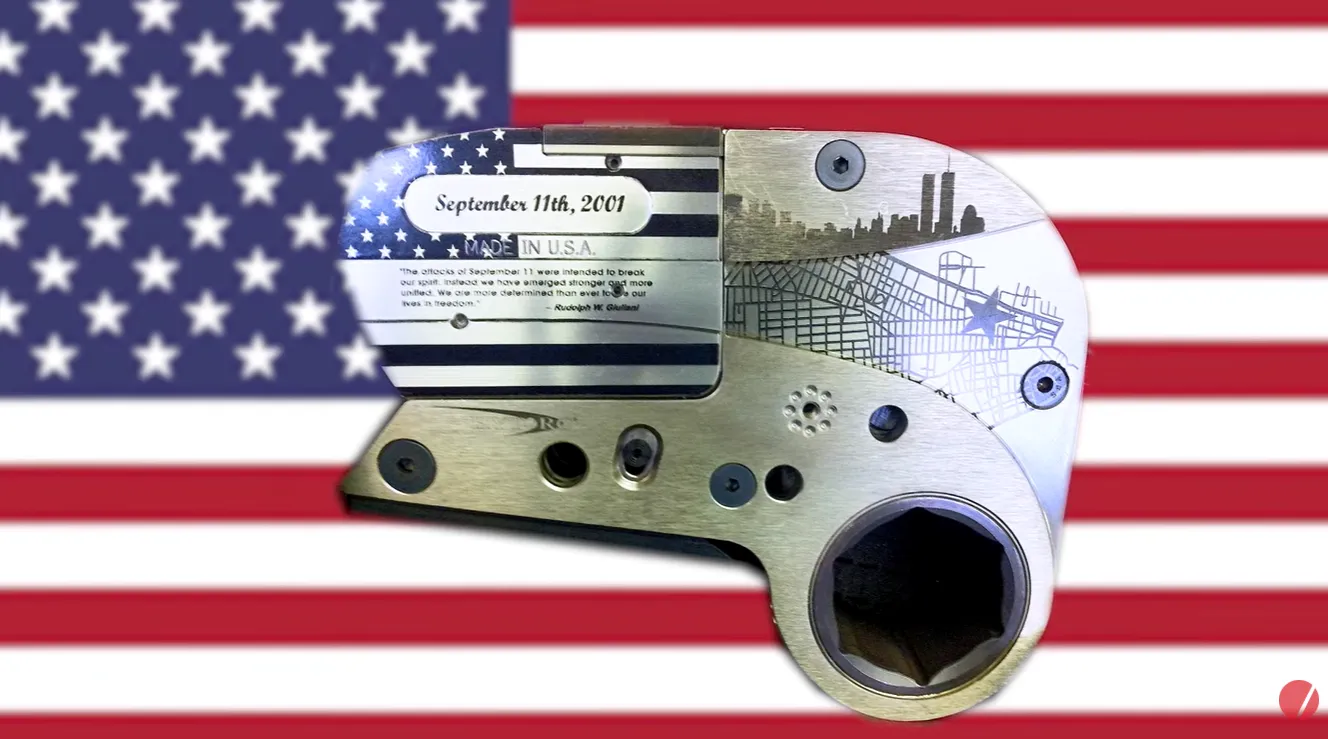 hytorc stealth hydraulic torque tool with world trade center etching american flag background