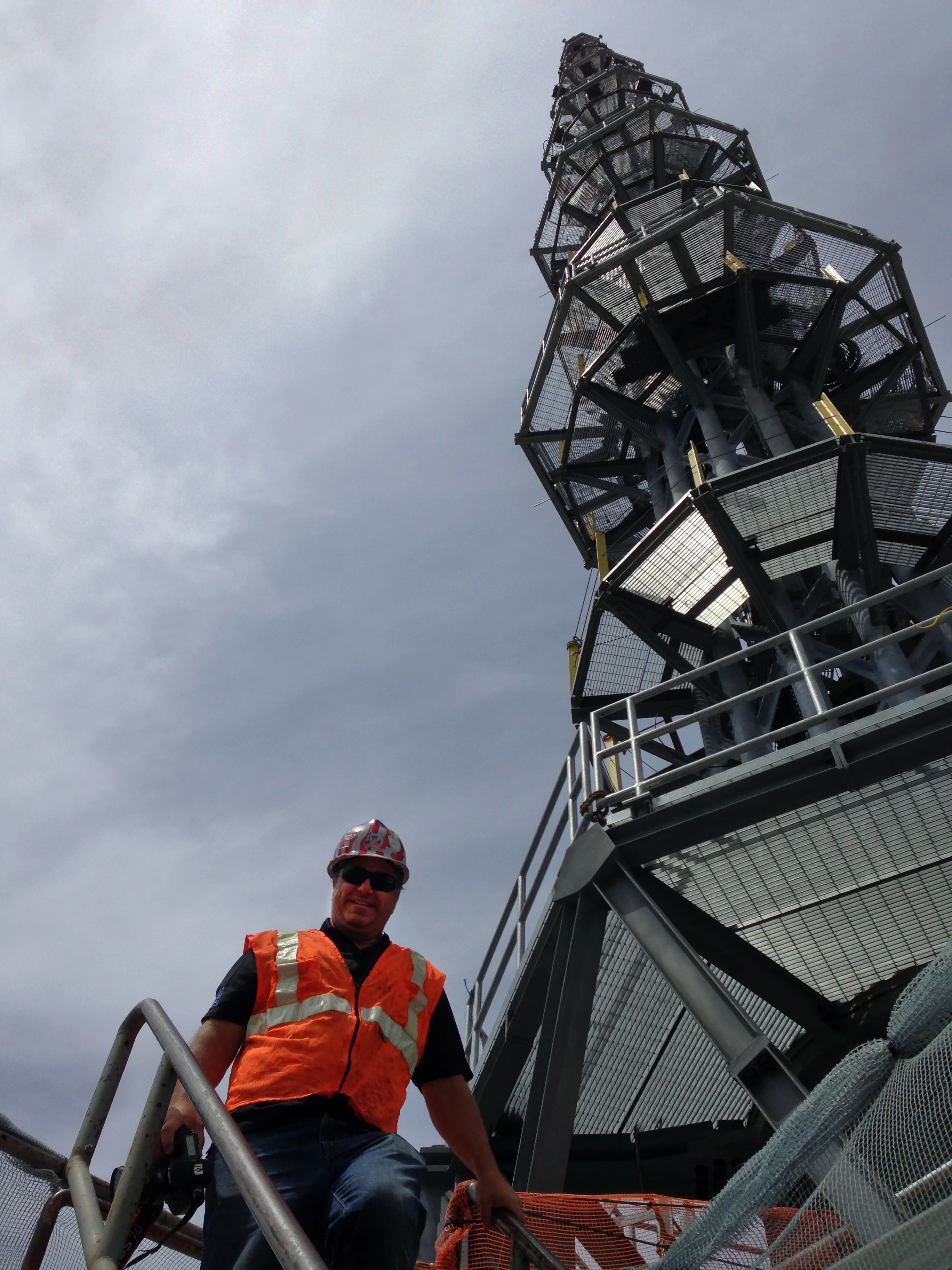 man on top of one world trader center spire