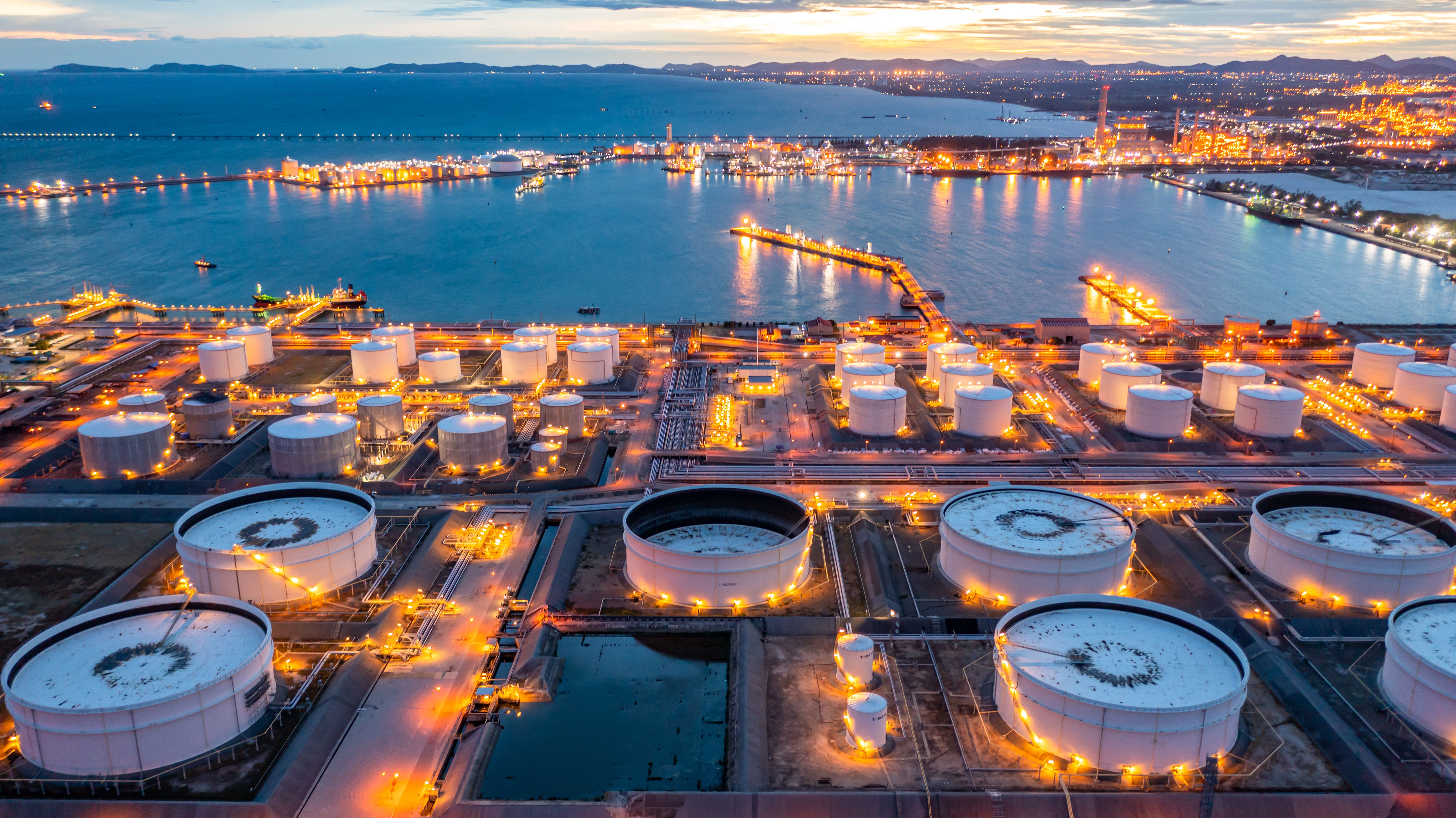 aerial view of oil refinery terminal storage at night