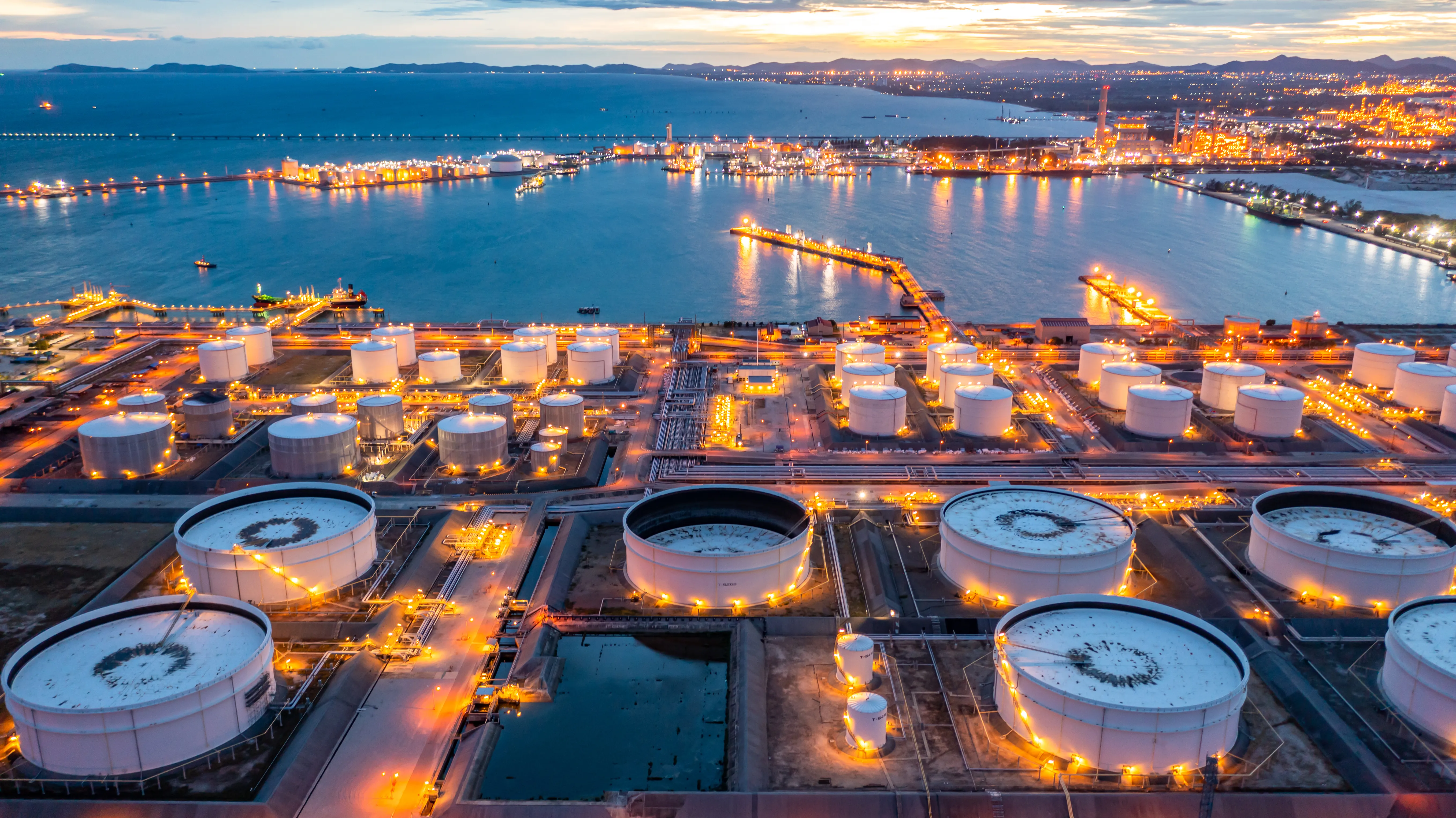 aerial view of oil refinery terminal storage at night
