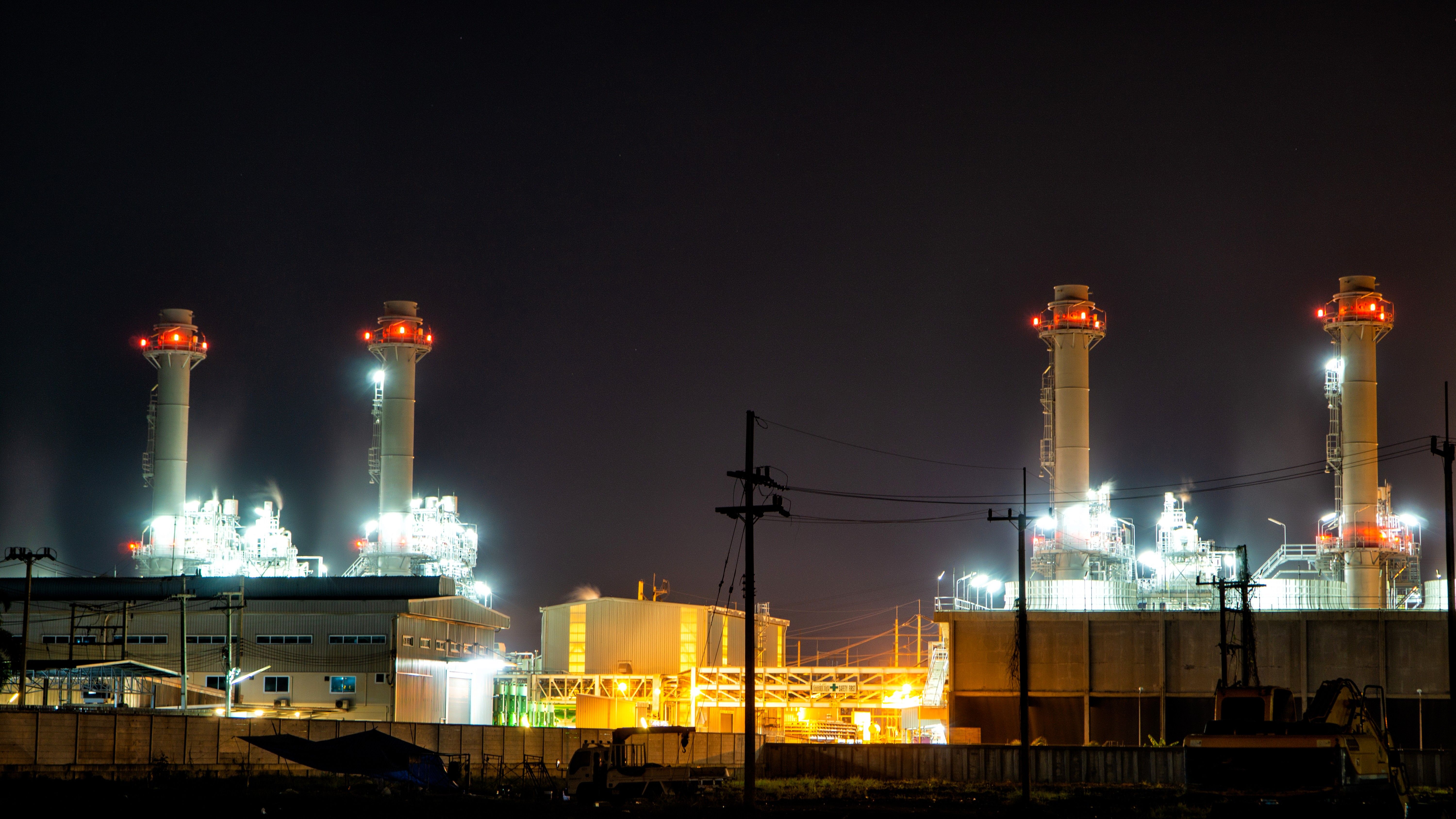 gas power plant at night smoke stacks