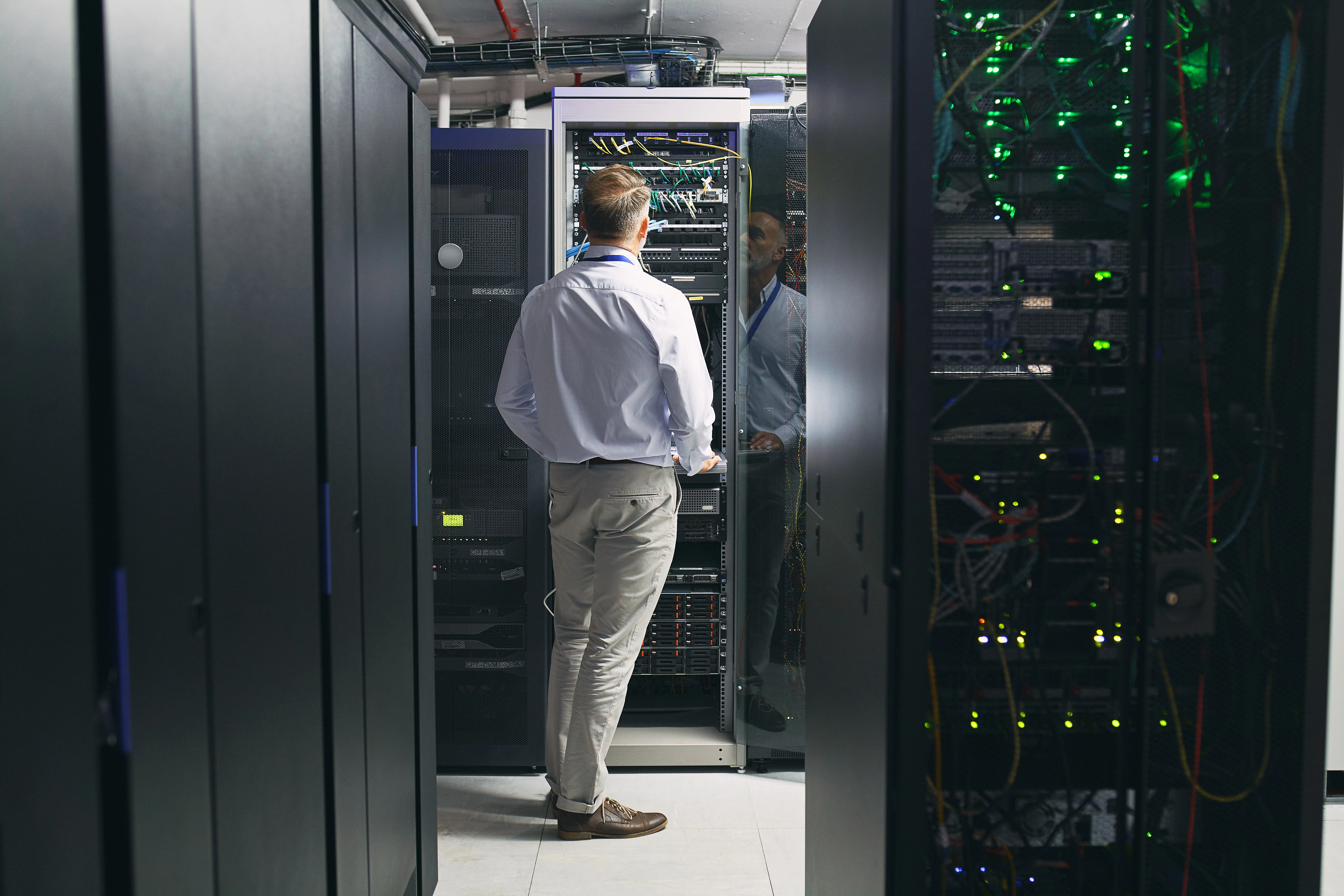 man in data center servers interior