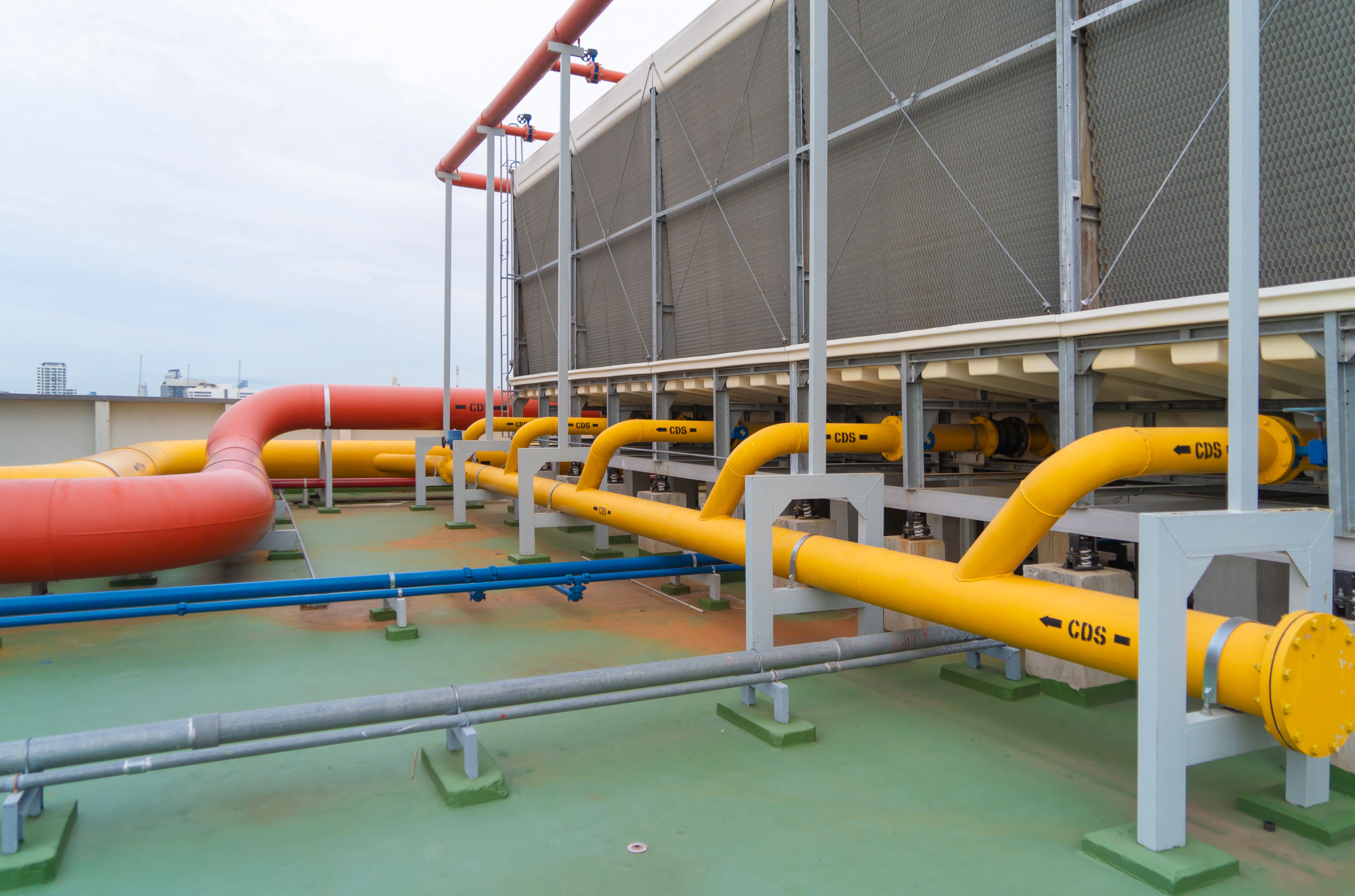 pipes with bolts on cooling system on industrial data center roof