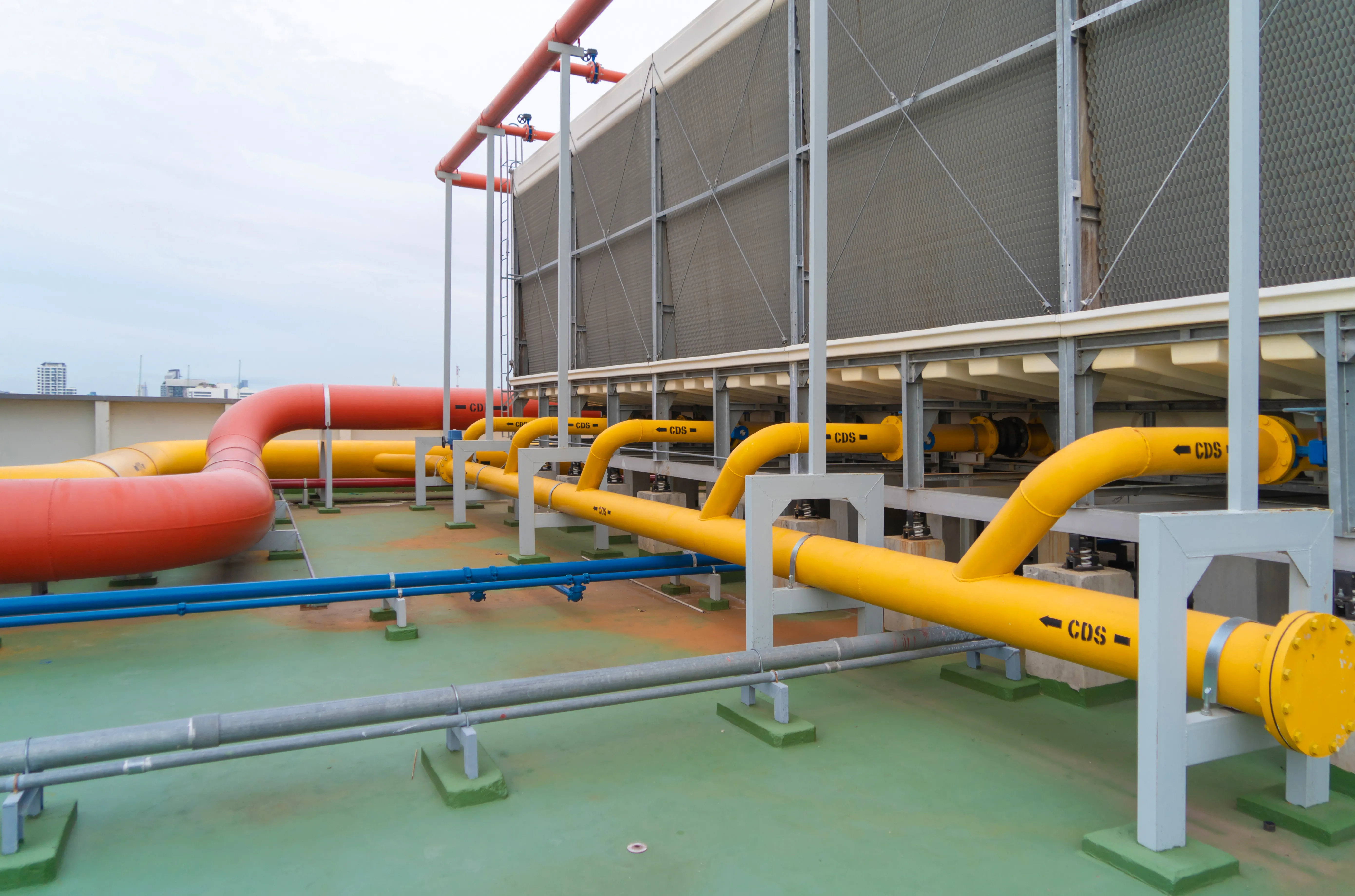 pipes with bolts on cooling system on industrial data center roof