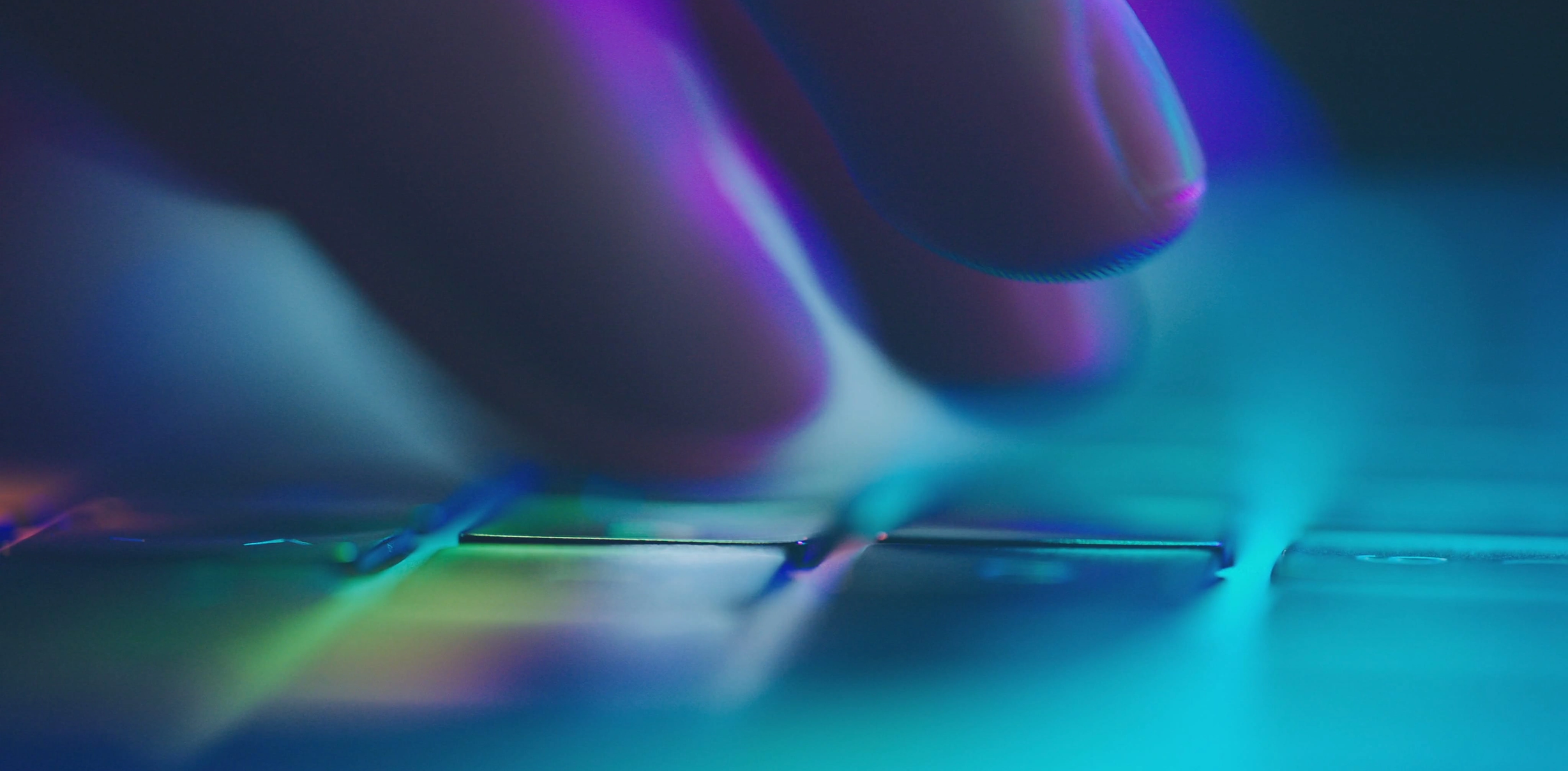 Close-up of hands touching screen