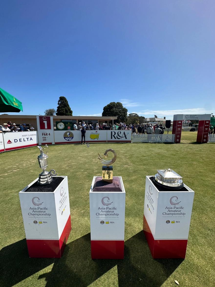 From right to left: A replica of the Claret Jug, the Asia-Pacific Amateur Championship trophy and a replica of the Masters trophy.