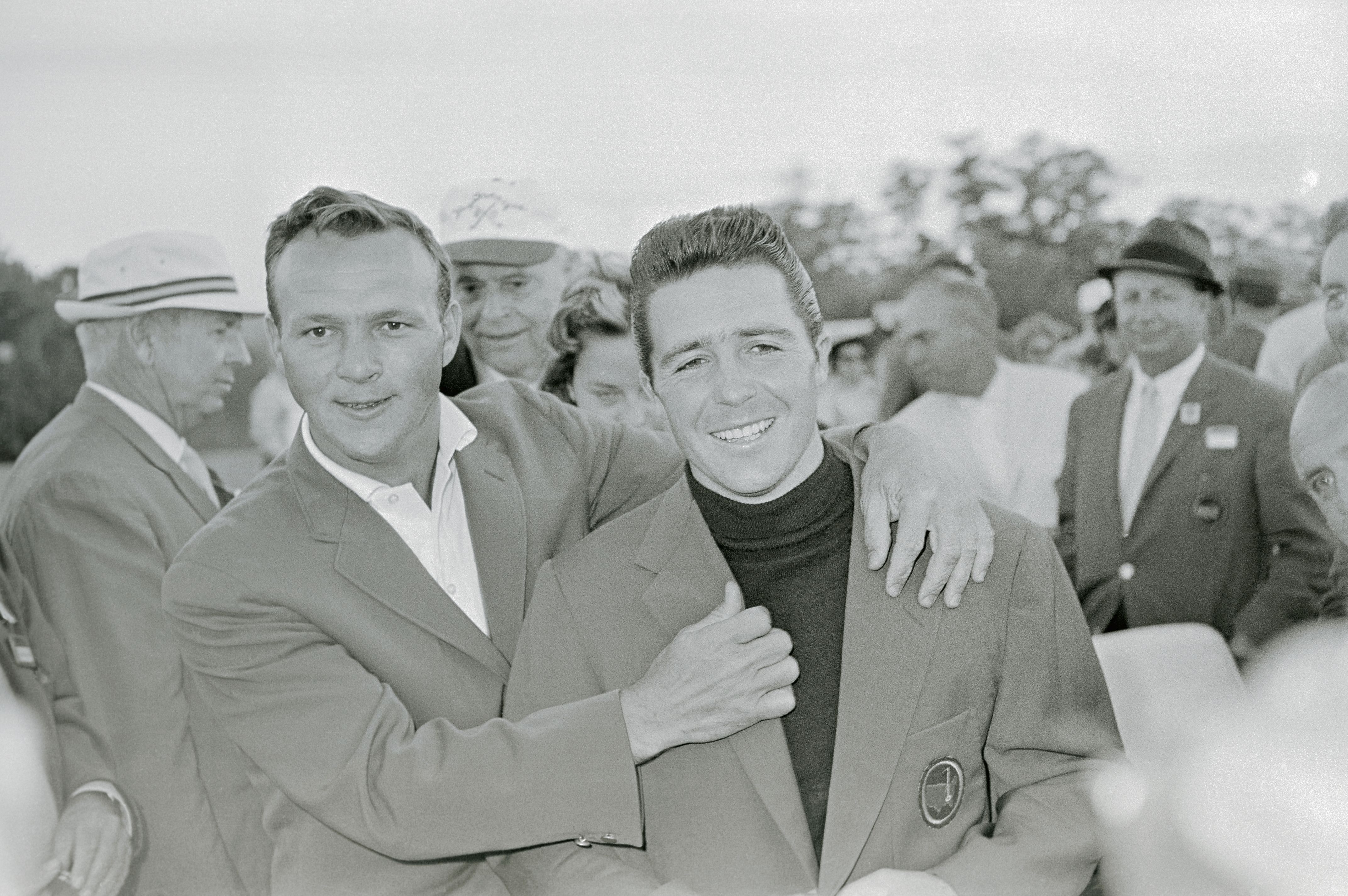 Gary Player and Arnold Palmer after Player wins the 1961 Masters.