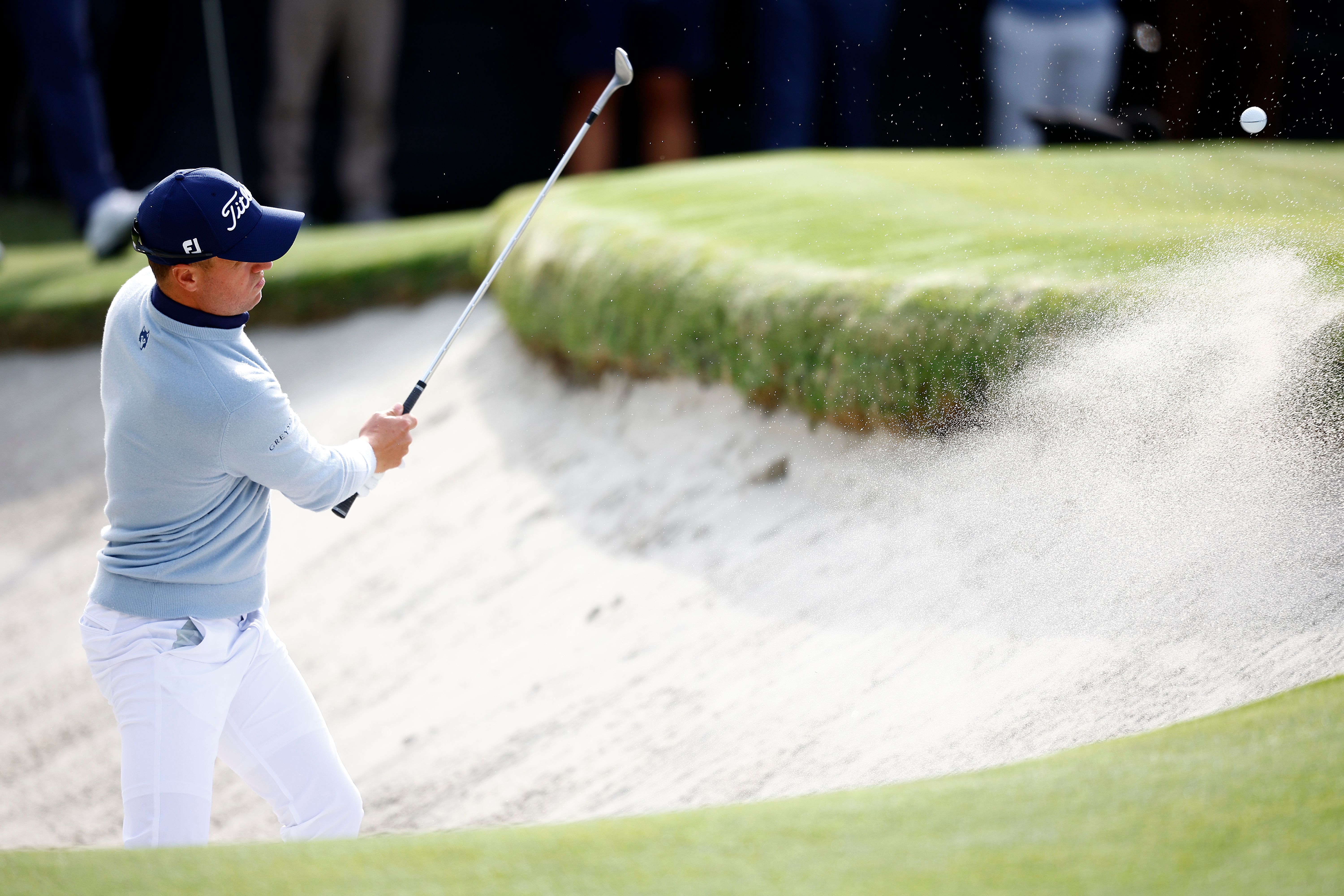 Justin Thomas plays his shot from the bunker on the 10th hole during the first round of the The Genesis Invitational at Riviera Country Club.