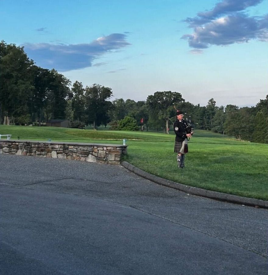 A bagpiper plays at the final round at Hillendale Country Club in Baltimore, MD.