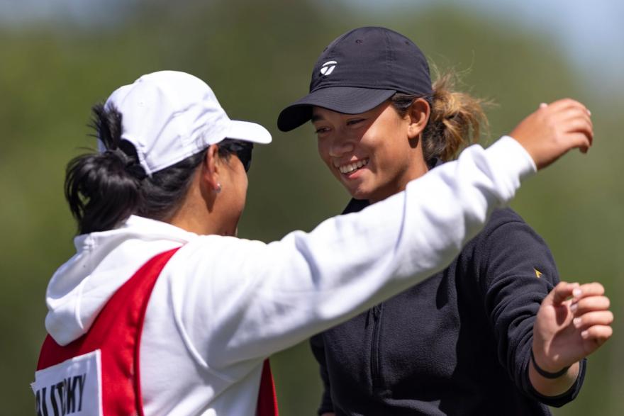 Eila Galitsky hugs her caddie.