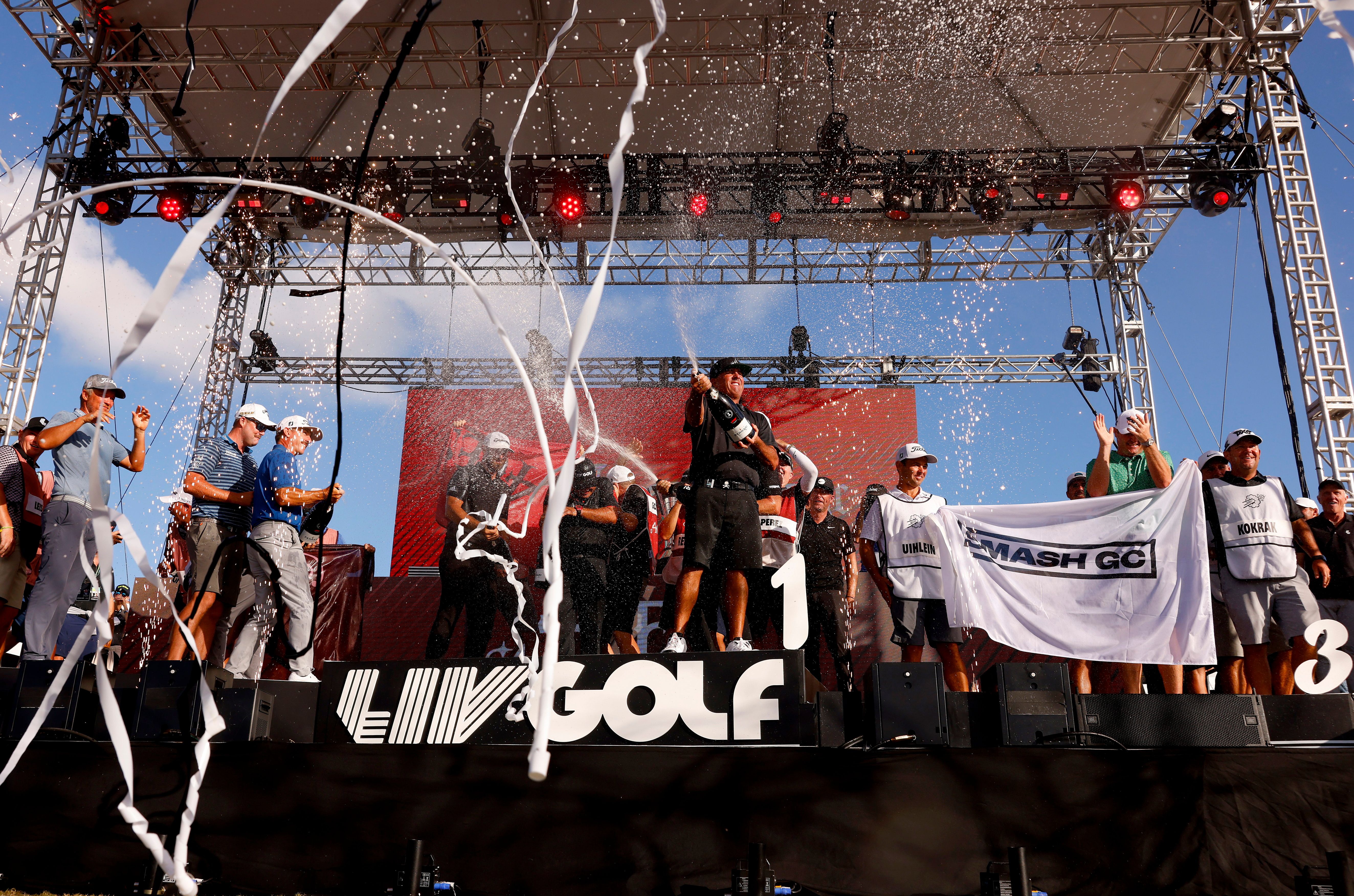 Pat Perez of 4 Aces GC and teammates celebrates their team win on stage during the team championship stroke-play round of the LIV Golf Invitational - Miami at Trump National Doral Miami.