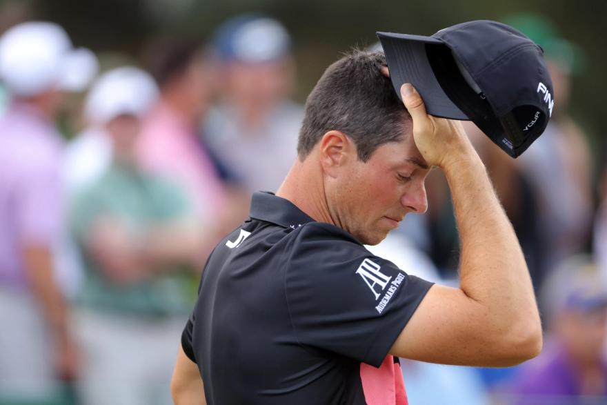 Viktor Hovland places his hand over head in frustration at the 2024 Masters.